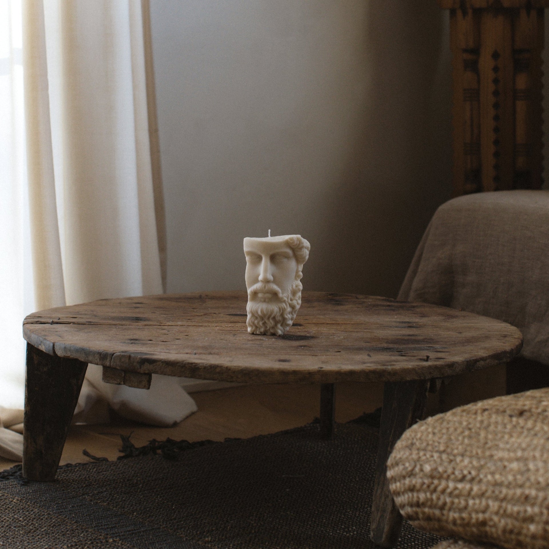 Close-up detail of handmade Greek face sculptural candle showing smooth soy wax texture and artisan craftsmanship