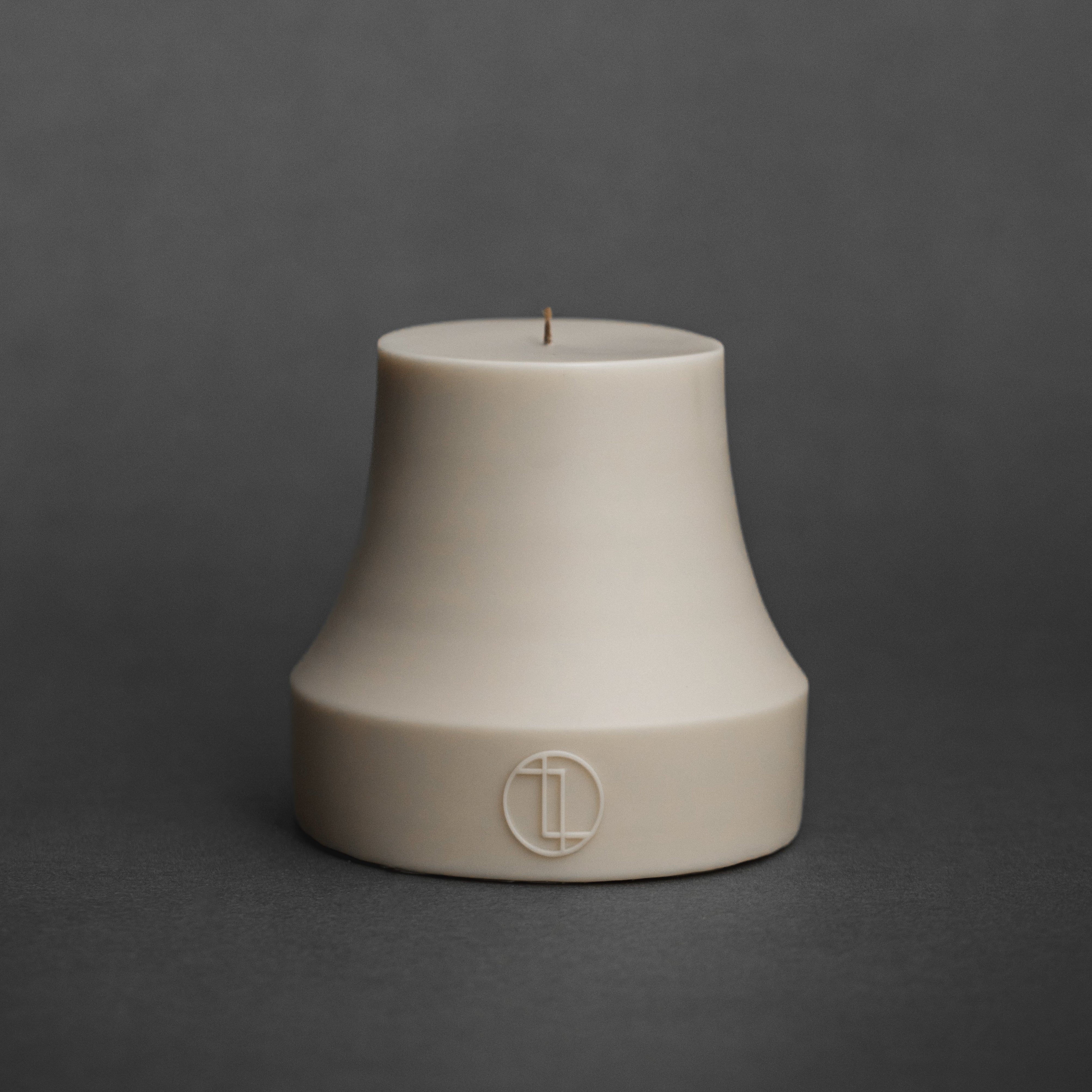 Close-up of handmade Bell Candle showing smooth soy wax texture and sculptural dome shape with cotton wick detail