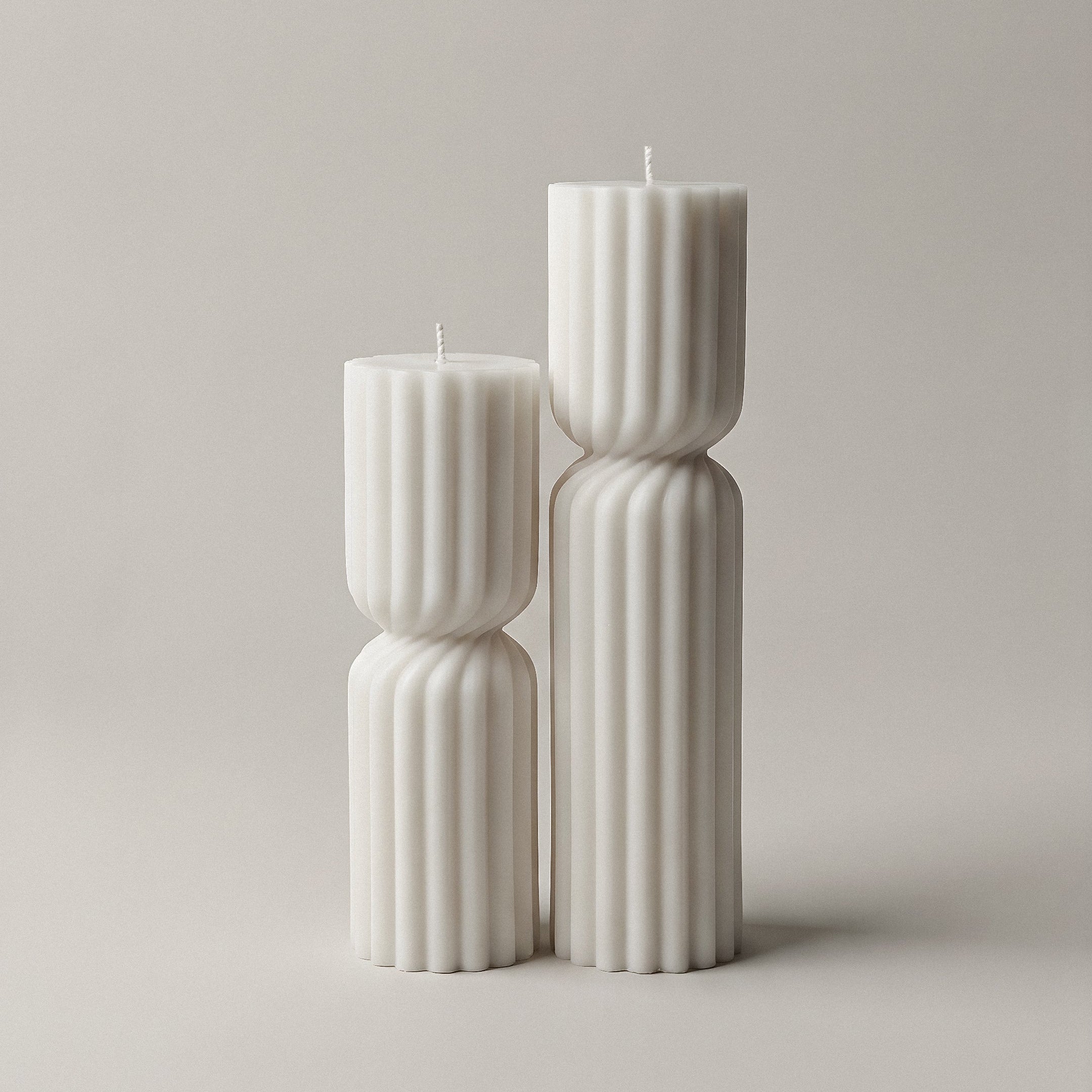 Close-up detail of handmade Spiral Spire sculptural candle showing textured soy wax curves and natural cotton wick