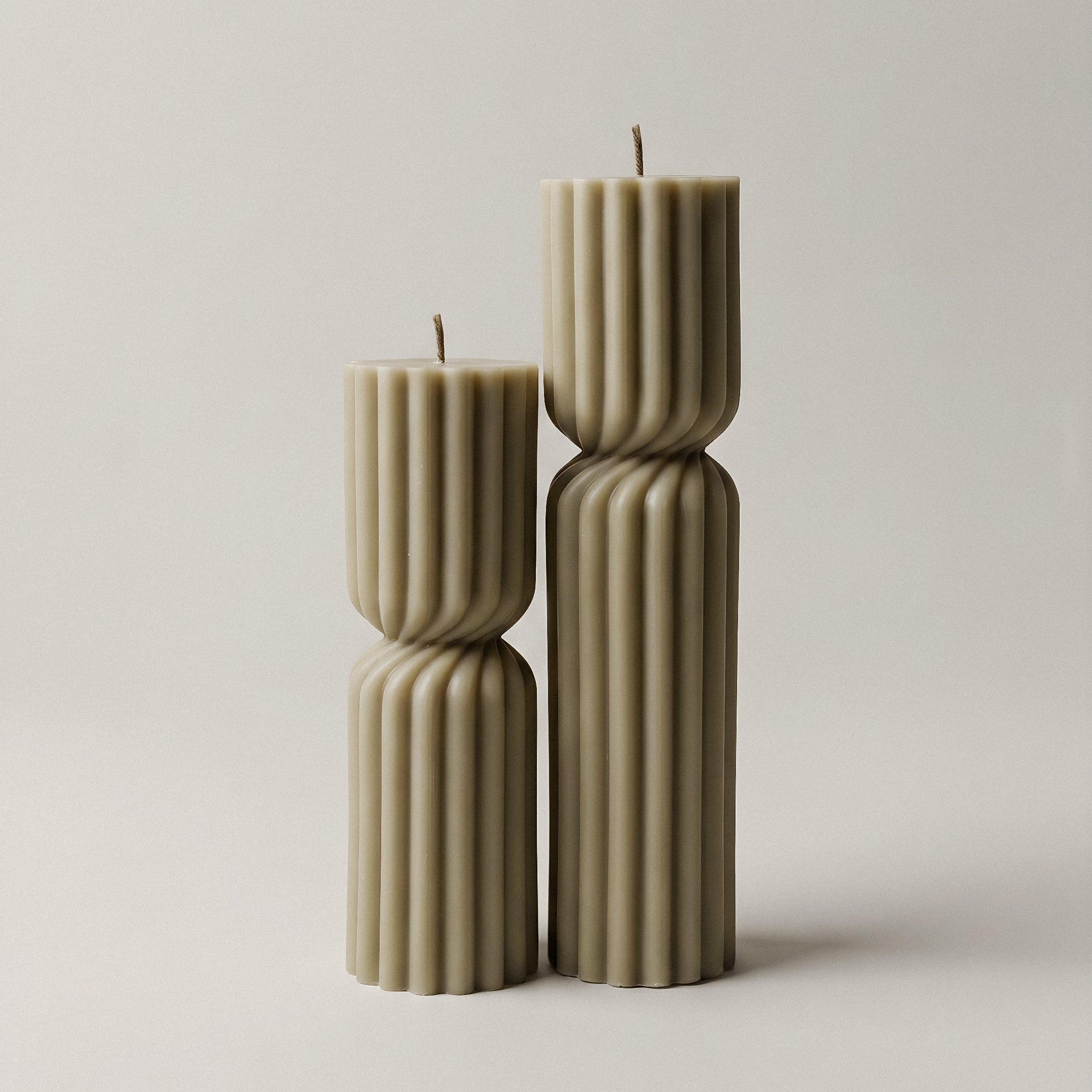Close-up detail of handmade Spiral Spire sculptural candle showing textured soy wax surface and organic spiral form