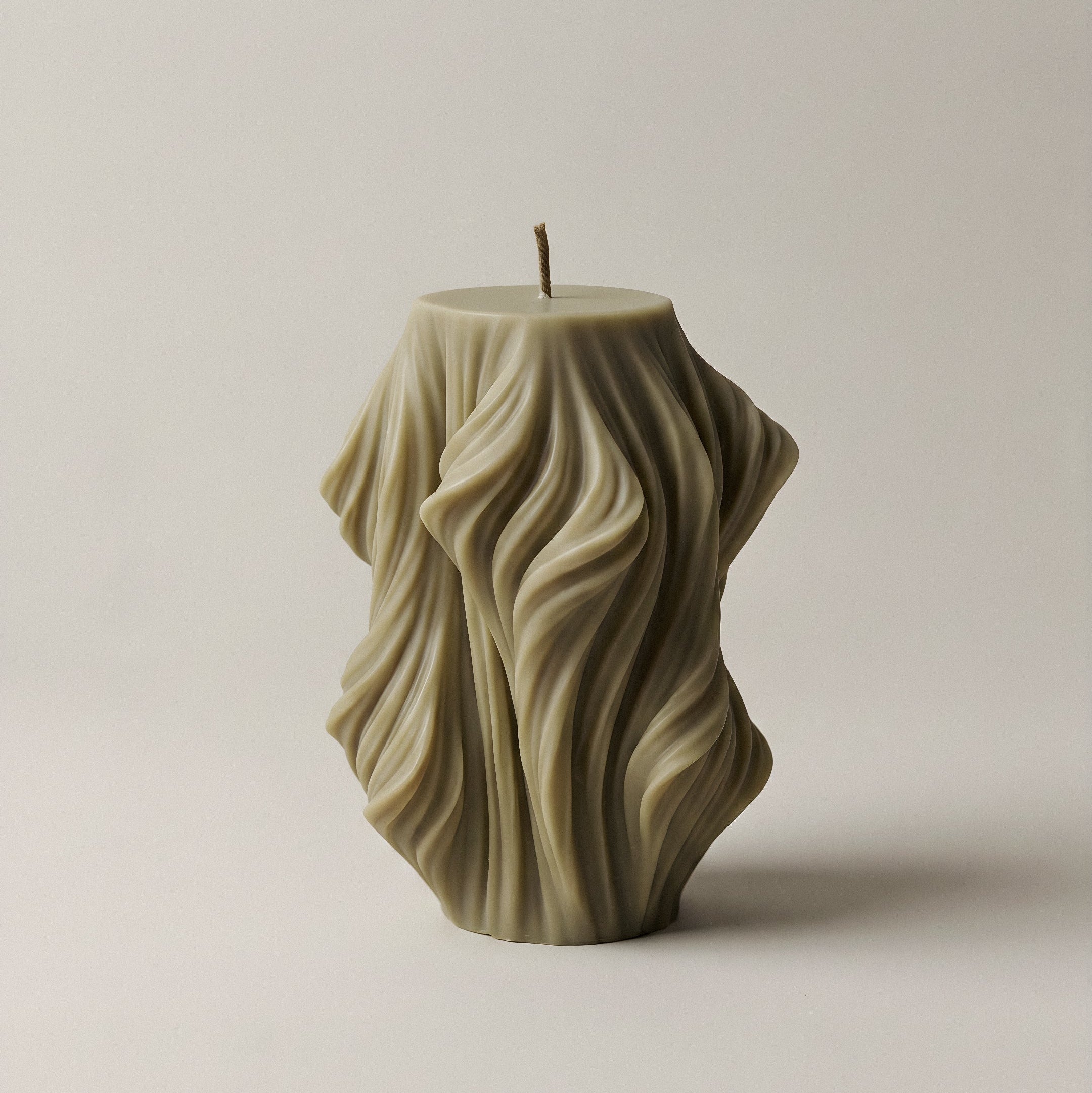 Close-up detail of handmade sculptural candle showing cascading wave texture in premium soy wax from Los Angeles
