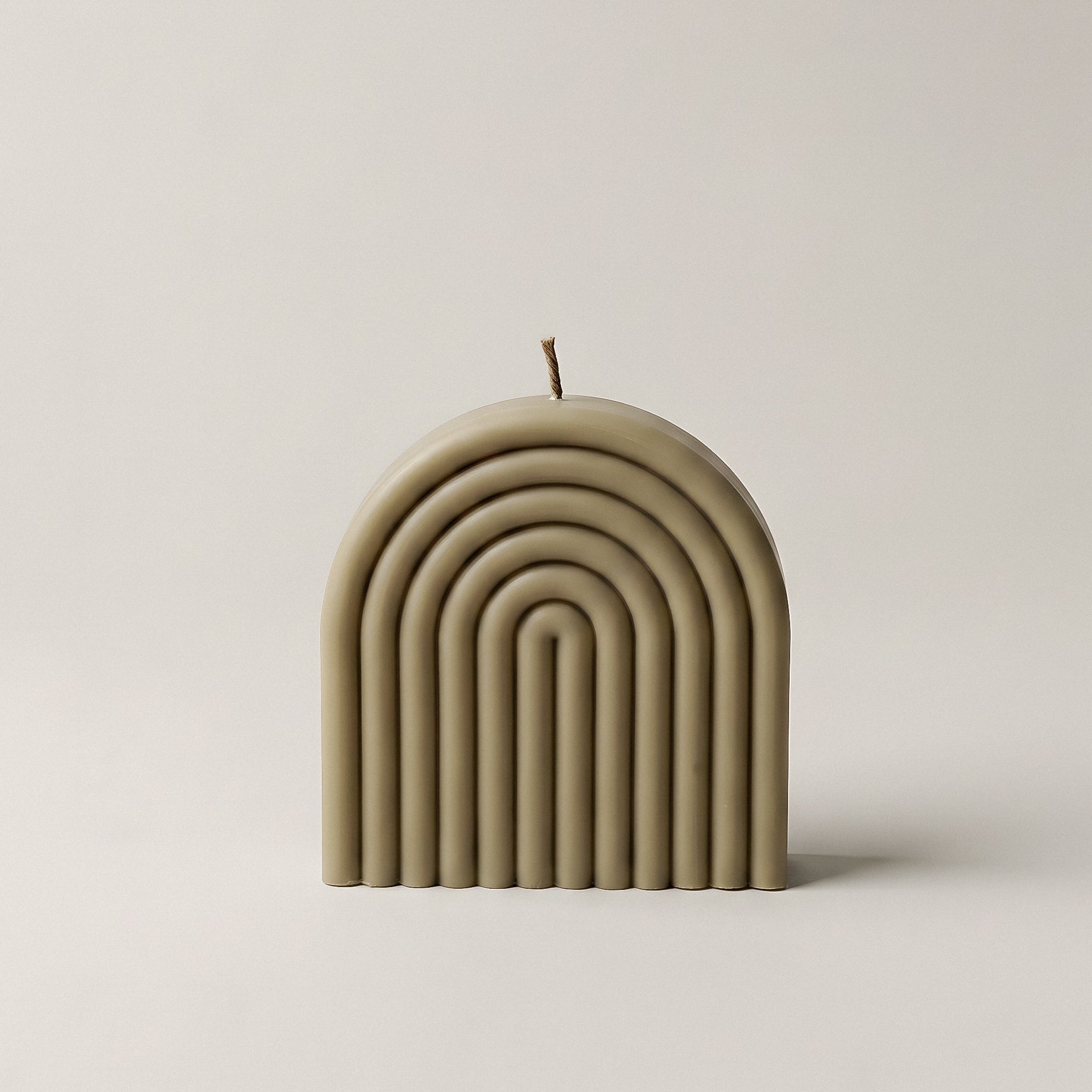 Handmade rainbow sculptural candle detail showing premium soy wax layers and texture in Los Angeles studio setting