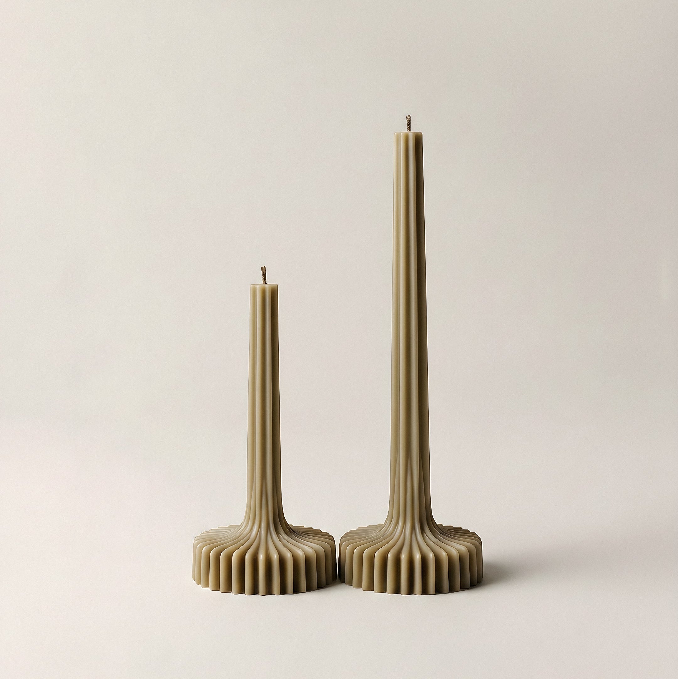 Close-up of handmade sculptural vase candle showing smooth soy wax texture and natural cotton wick detail