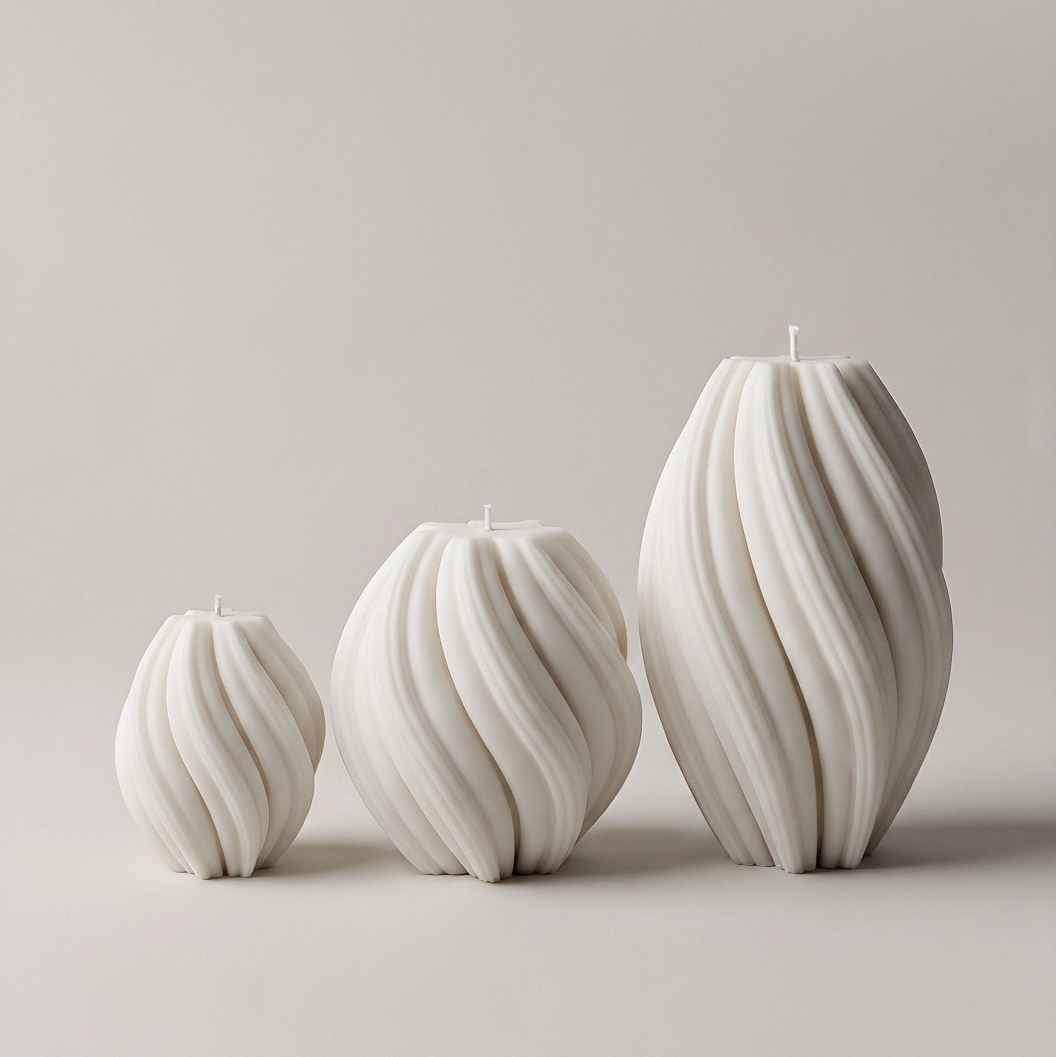 Close-up detail of handmade swirl sculptural candle showing premium soy wax texture and organic curved design