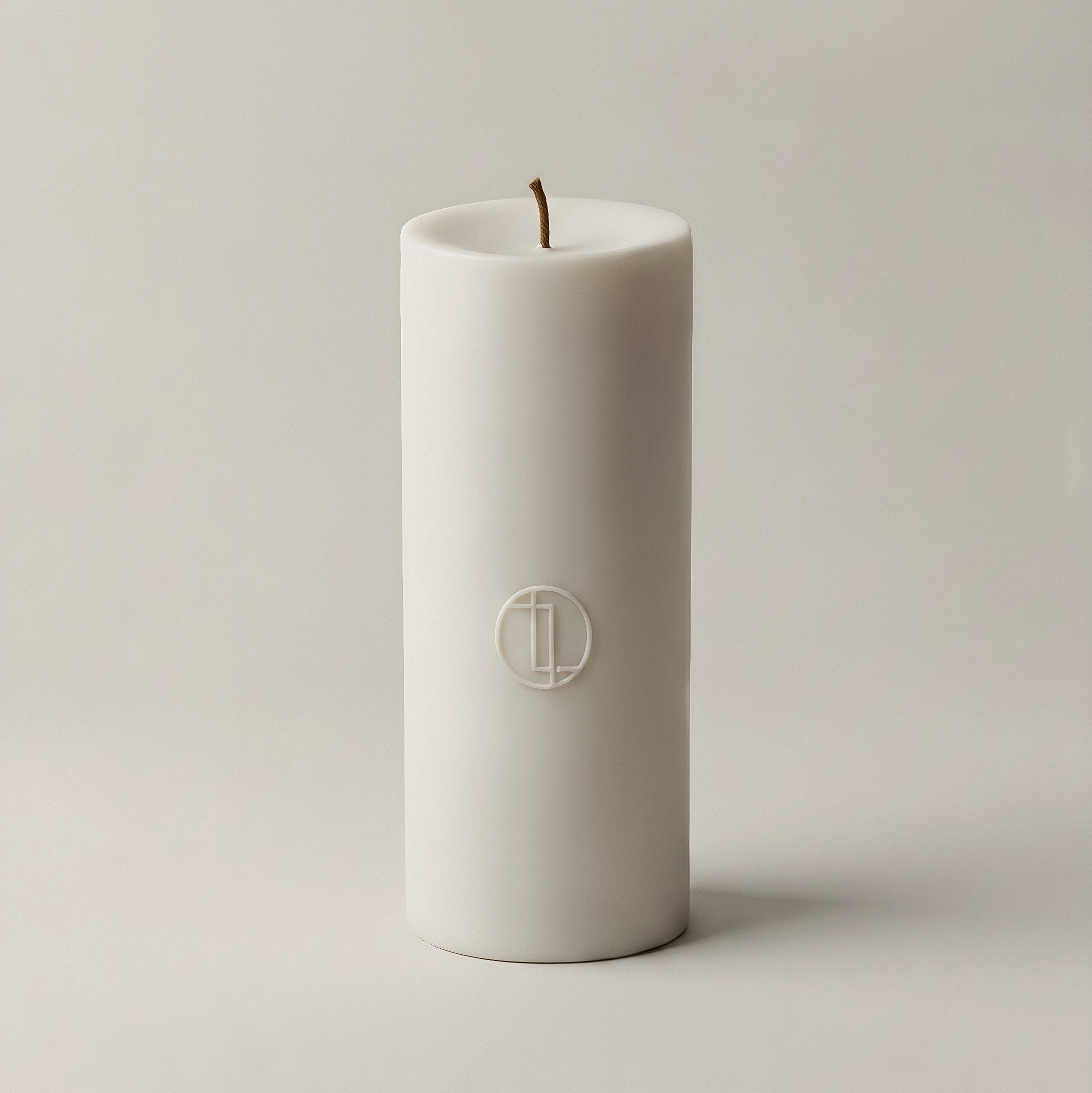Handmade unscented cylinder candle detail showing smooth soy wax texture and cotton wick from Los Angeles