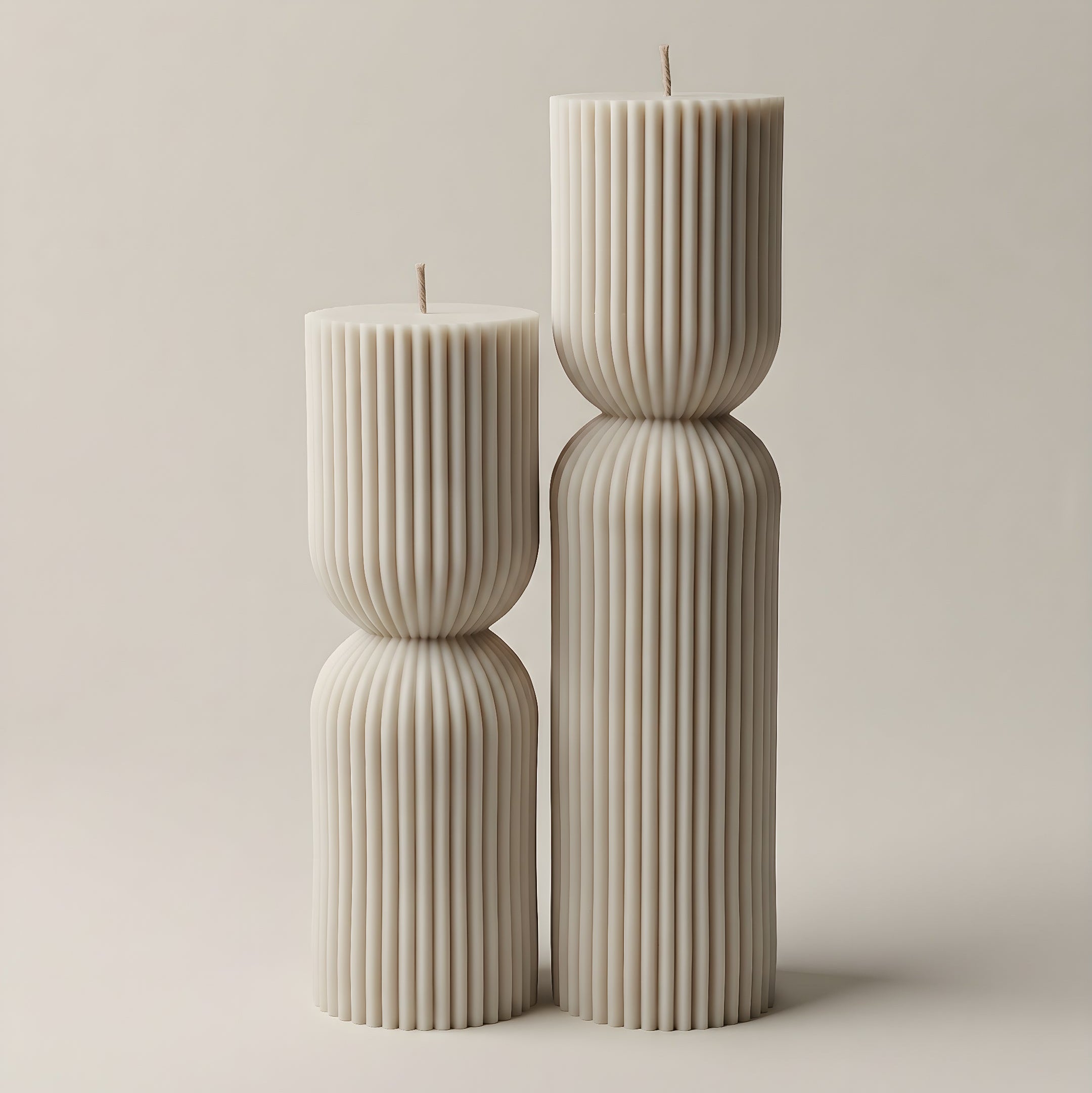 White hourglass sculptural candle made from premium soy wax, handmade in Los Angeles on a neutral background