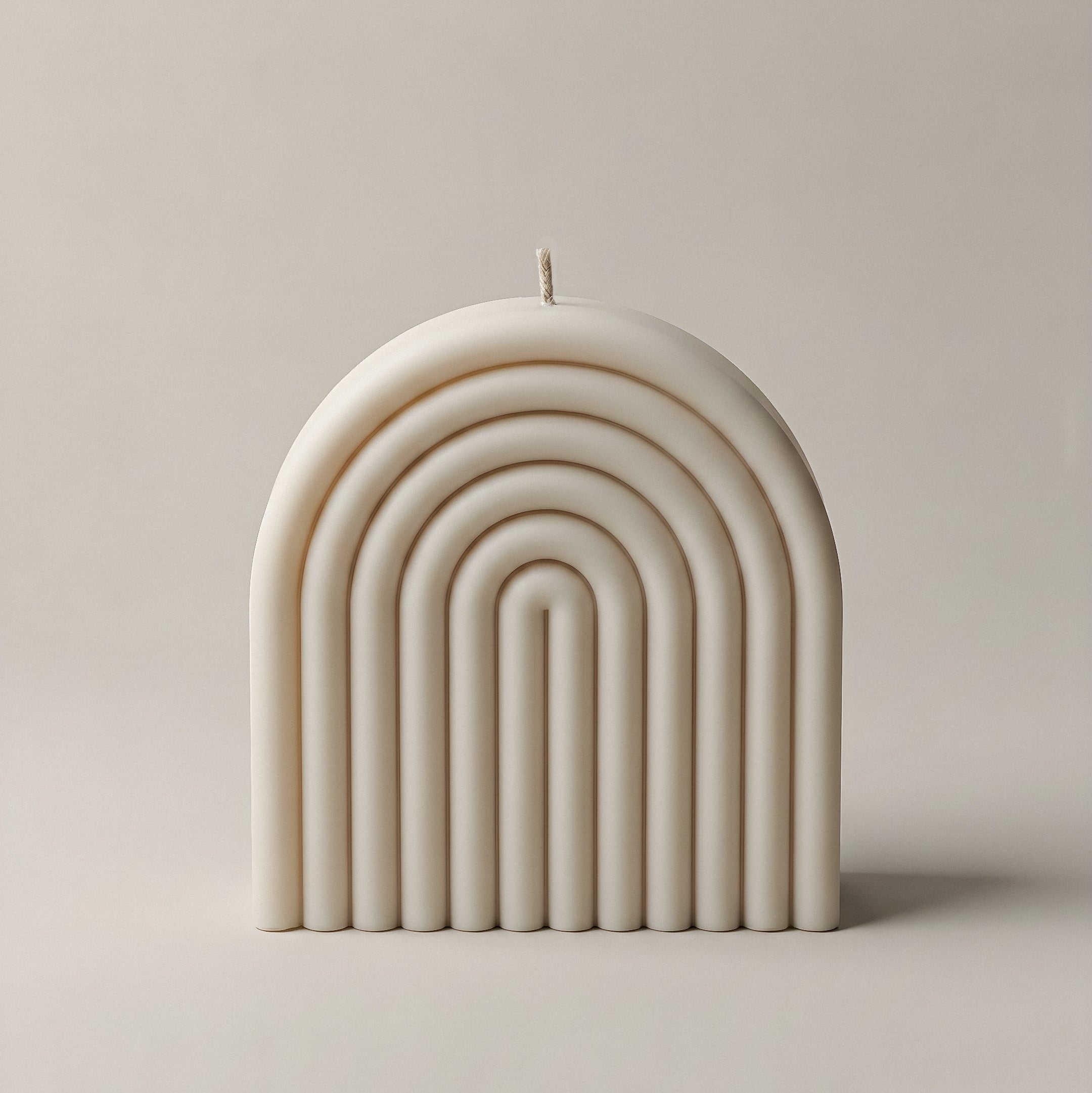 Handmade rainbow sculptural candle made from premium soy wax in Los Angeles shown against white background
