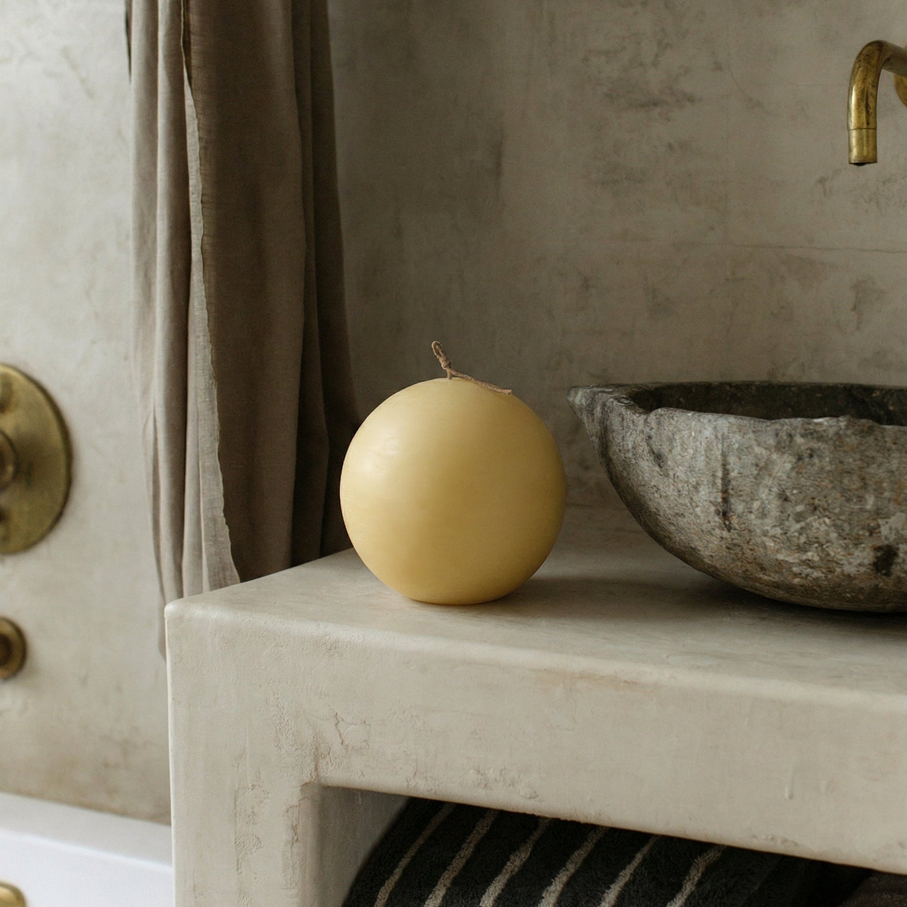 Handmade sphere candle detail showing smooth soy wax texture and sculptural form from Los Angeles artisan