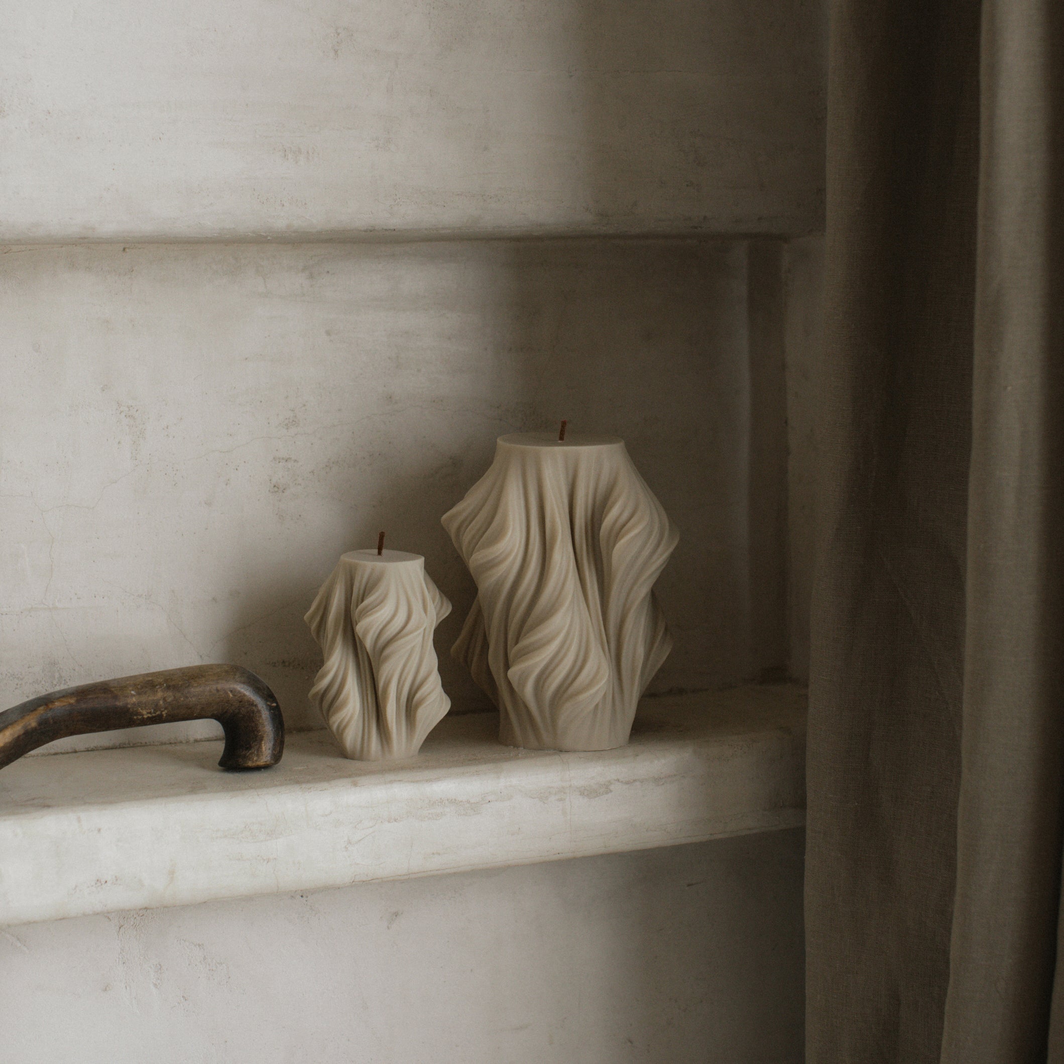 Close-up detail of handmade sculptural candle showing cascading wave texture in premium soy wax made in Los Angeles