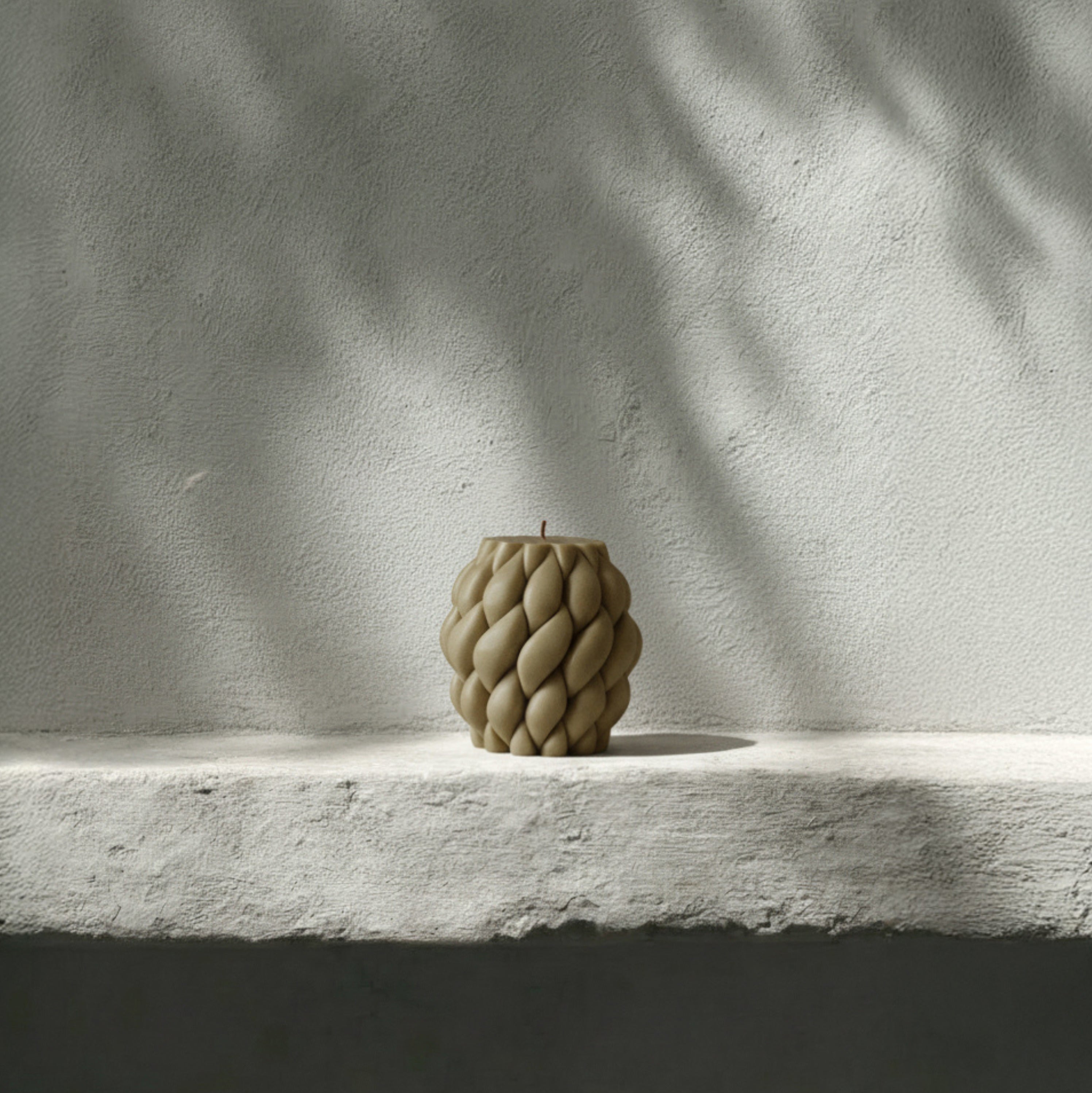 Handmade soy wax Knot Ball sculptural candle detail showing intricate twisted texture in natural light