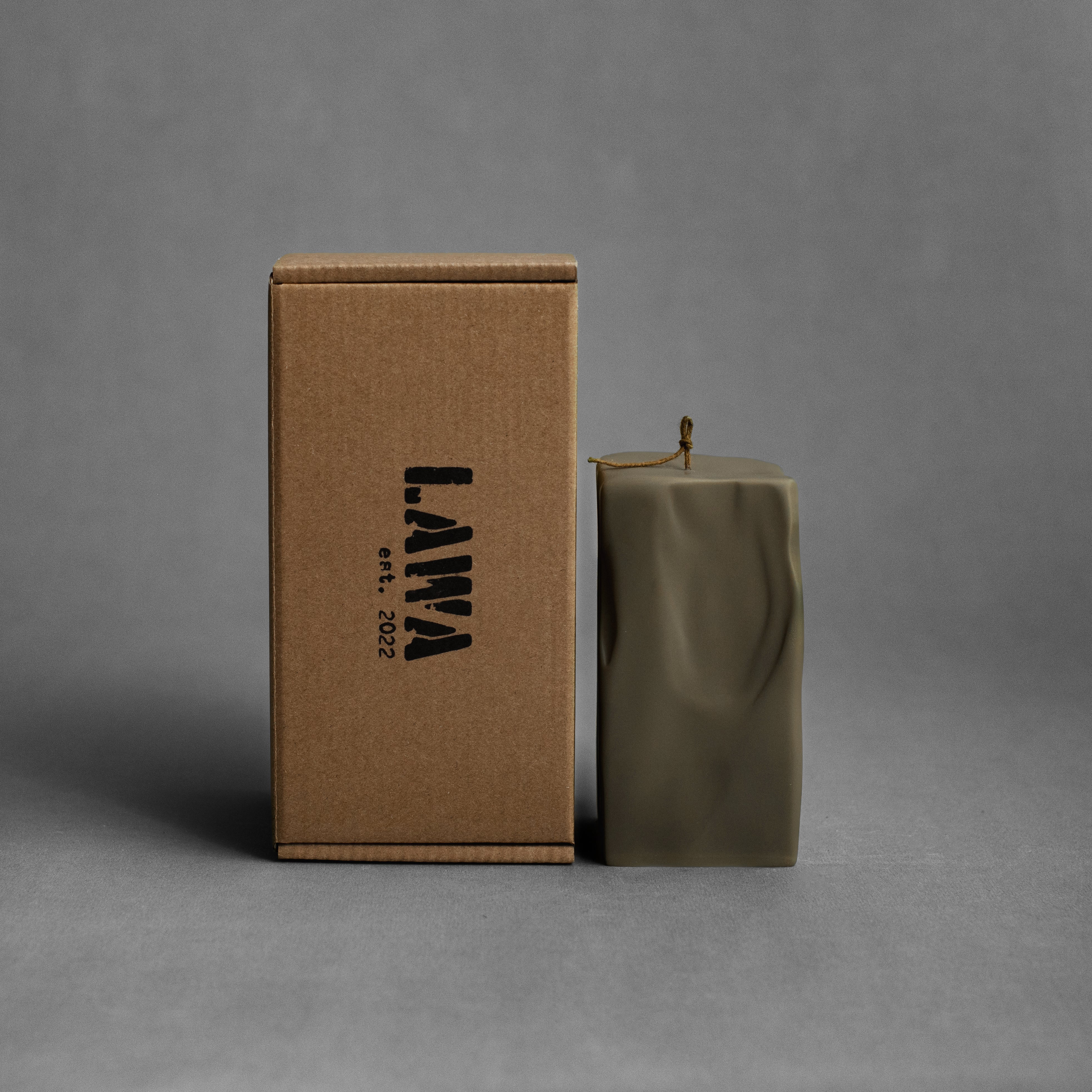 Large earthy green raw block pillar soy wax candle by LAWA, sculptural geometric decor piece in soy wax