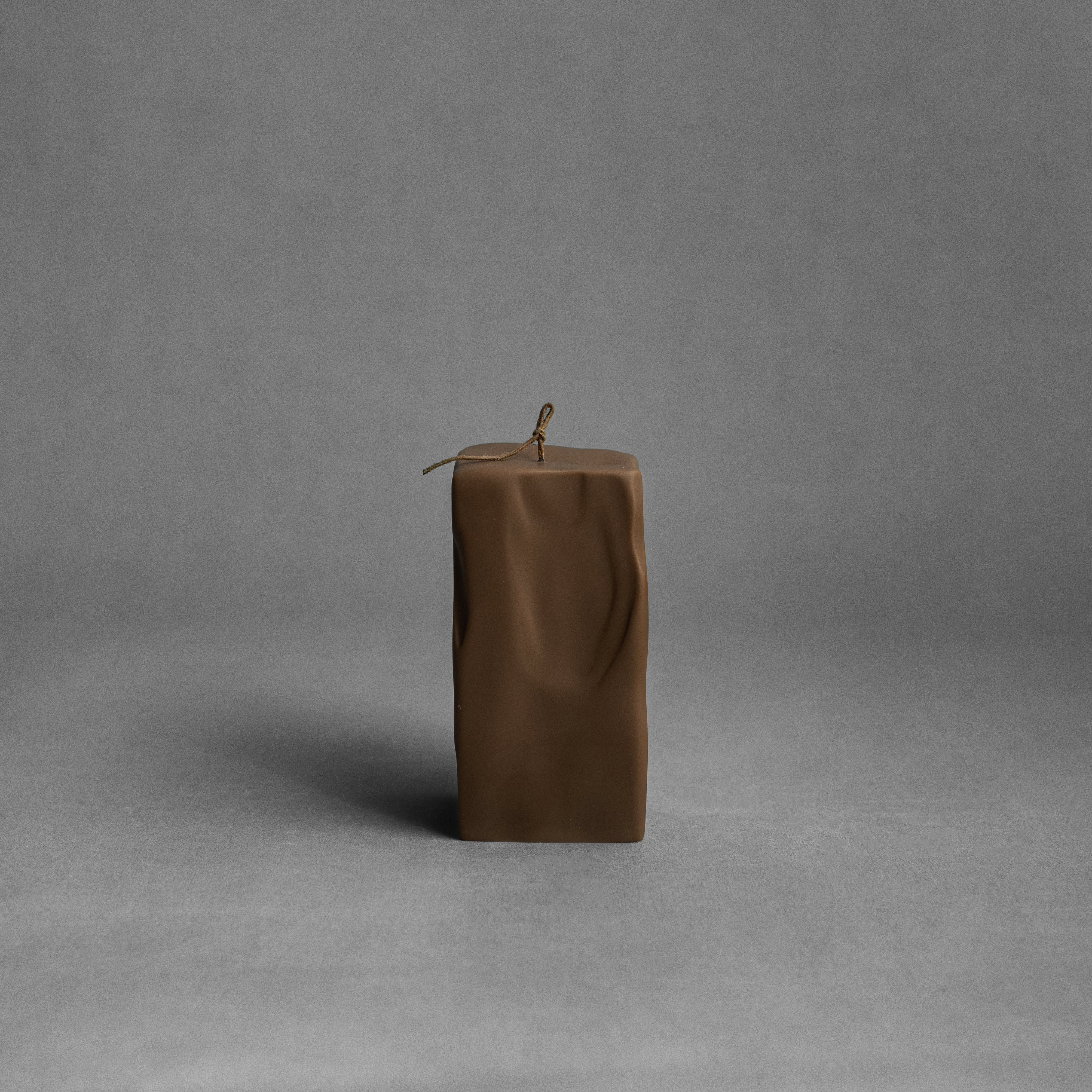 Large kobicha brown raw block soy wax pillar candle by LAWA featuring a bold geometric silhouette for a housewarming and birthday party