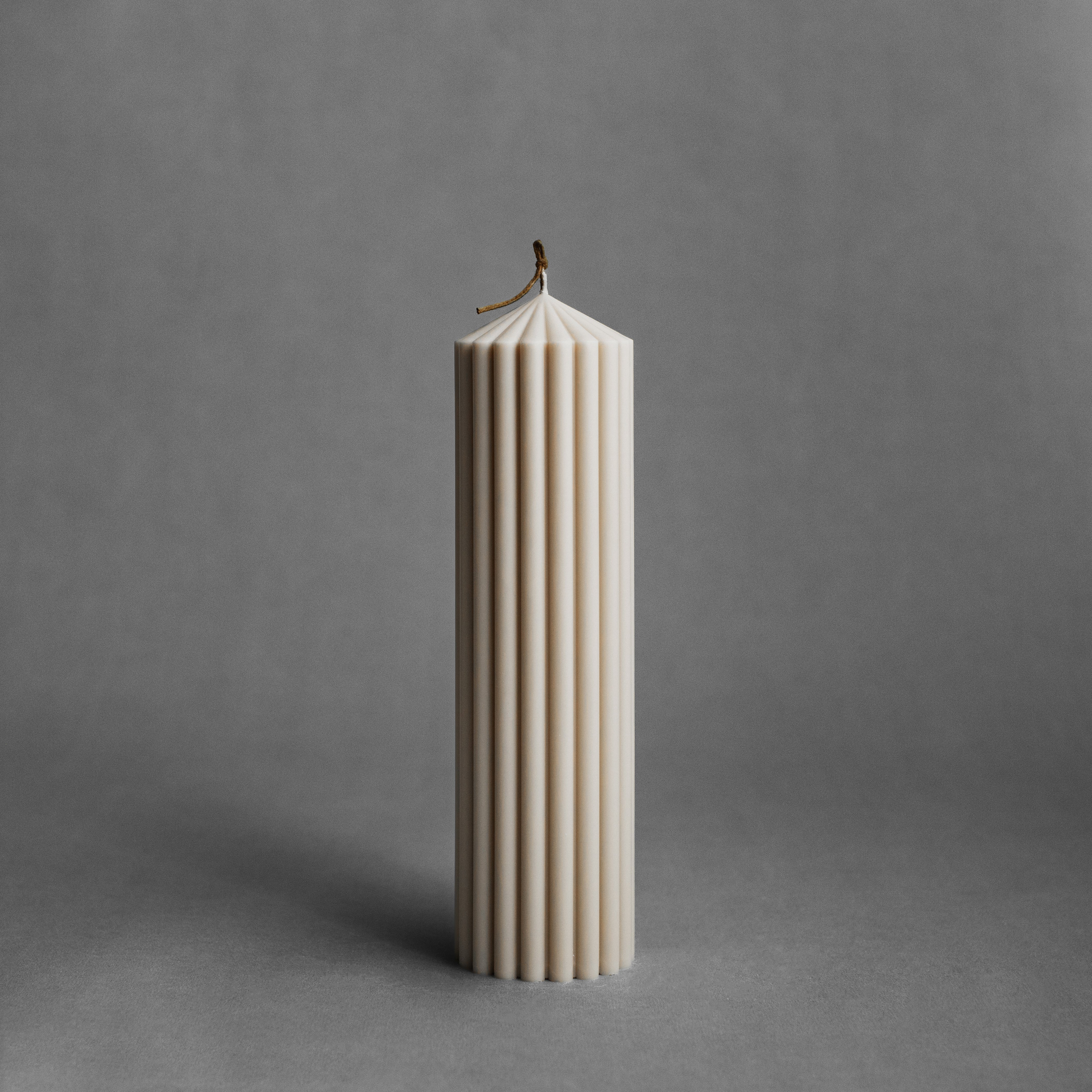 Large moon gray peak pillar candle by LAWA with striking tall pointed top