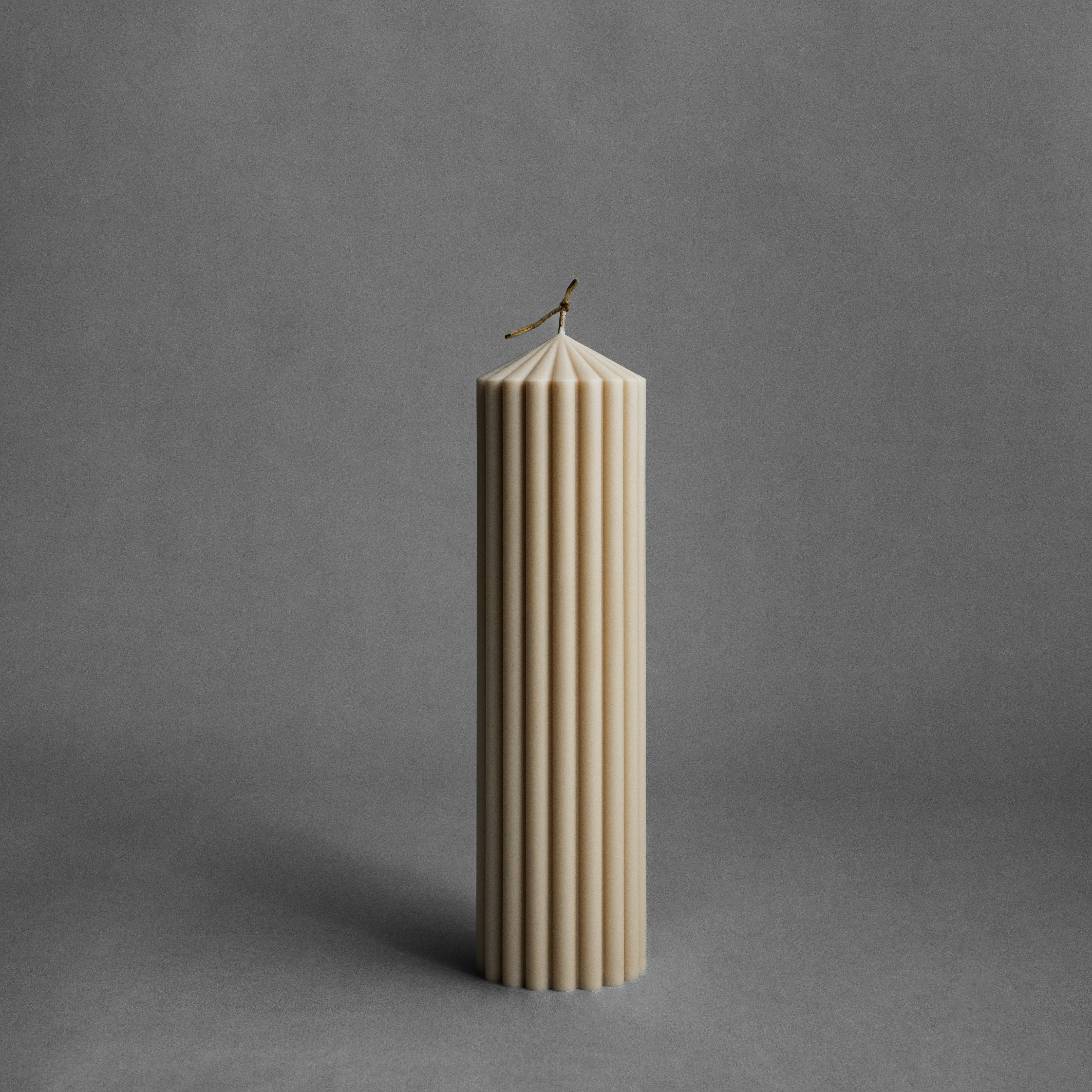 Large sandstone peak pillar candle by LAWA with striking tall pointed top