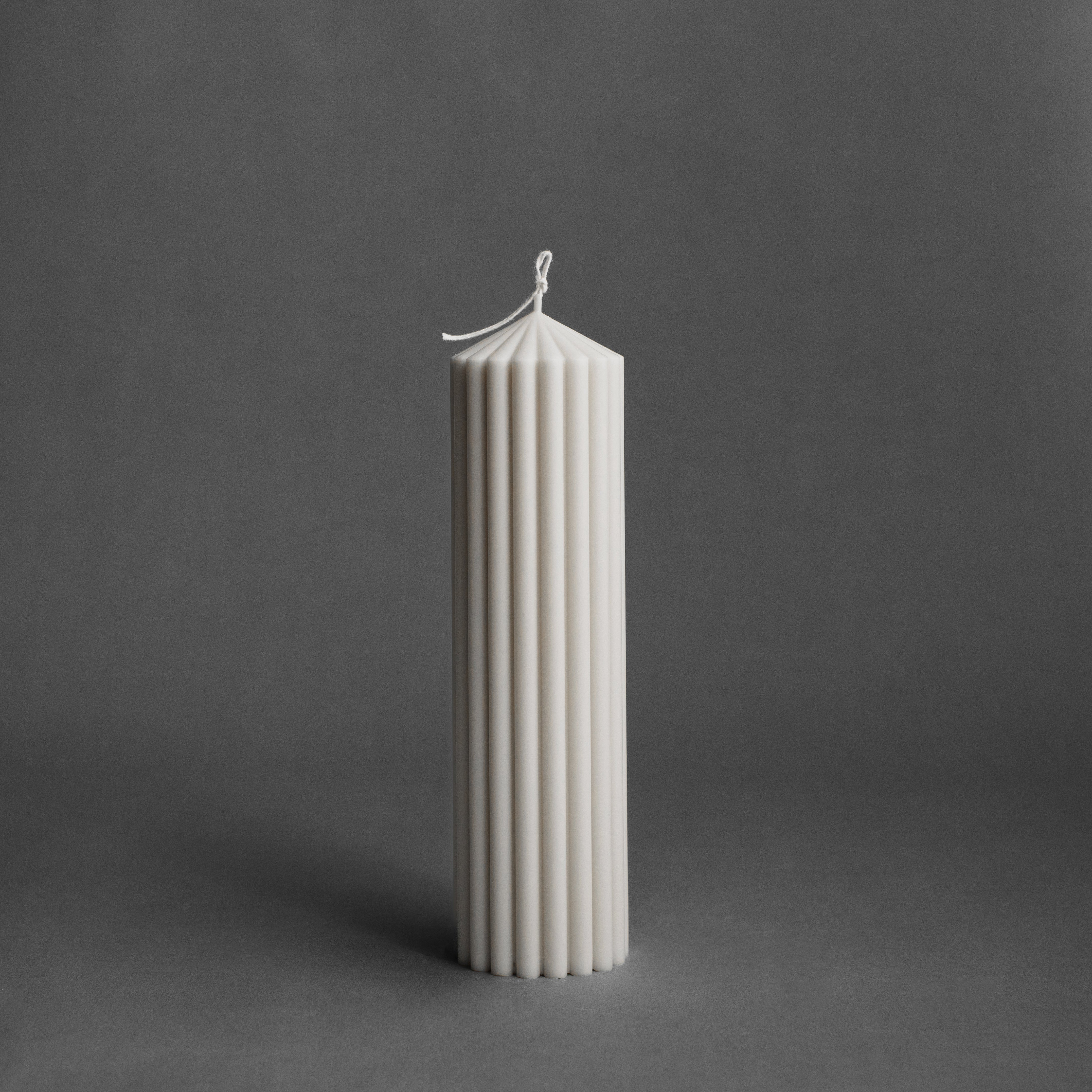 Large white peak pillar candle by LAWA with tall sculptural pointed top