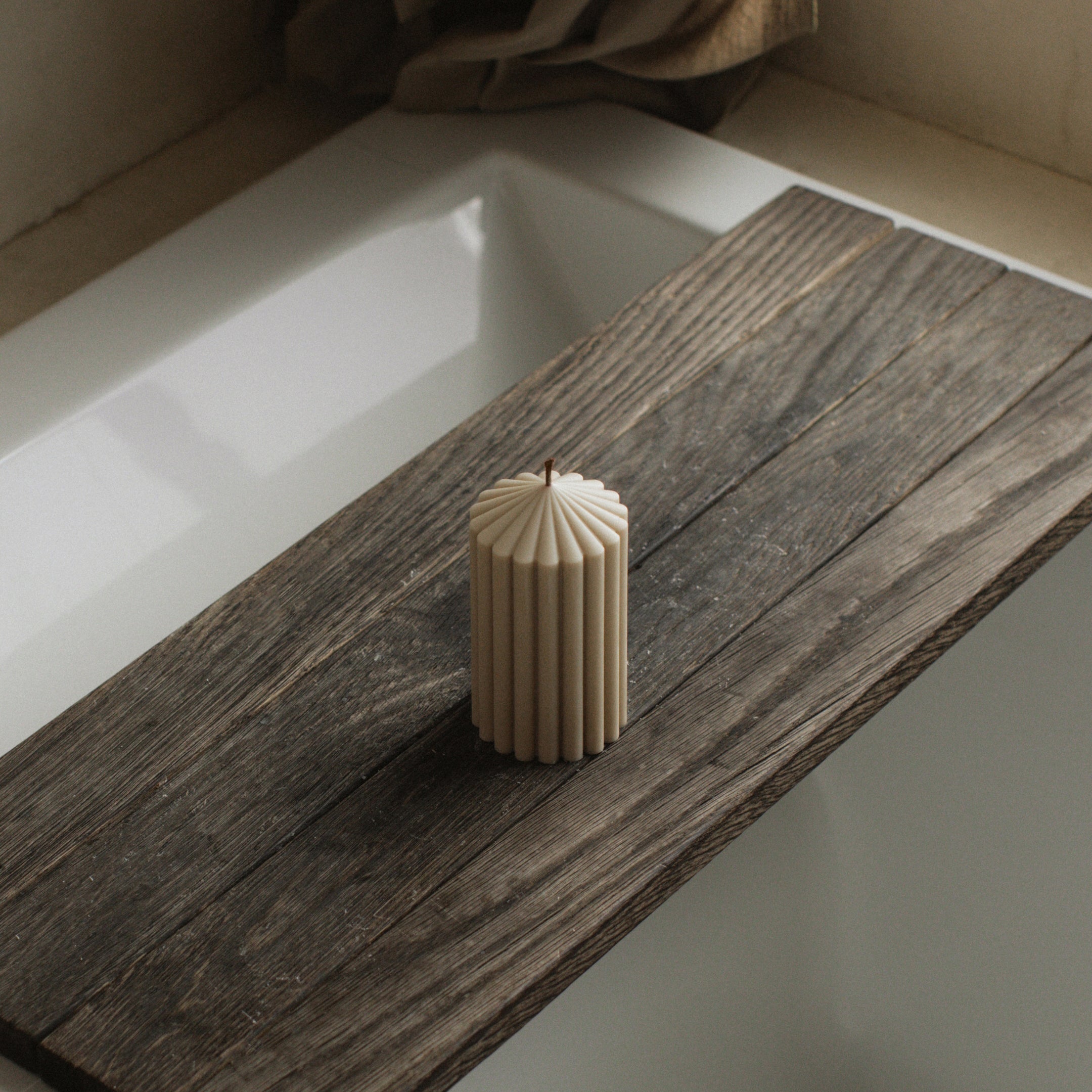 Minimalist small moon gray peak candle by LAWA with modern mountain-inspired shape on a wooden surface