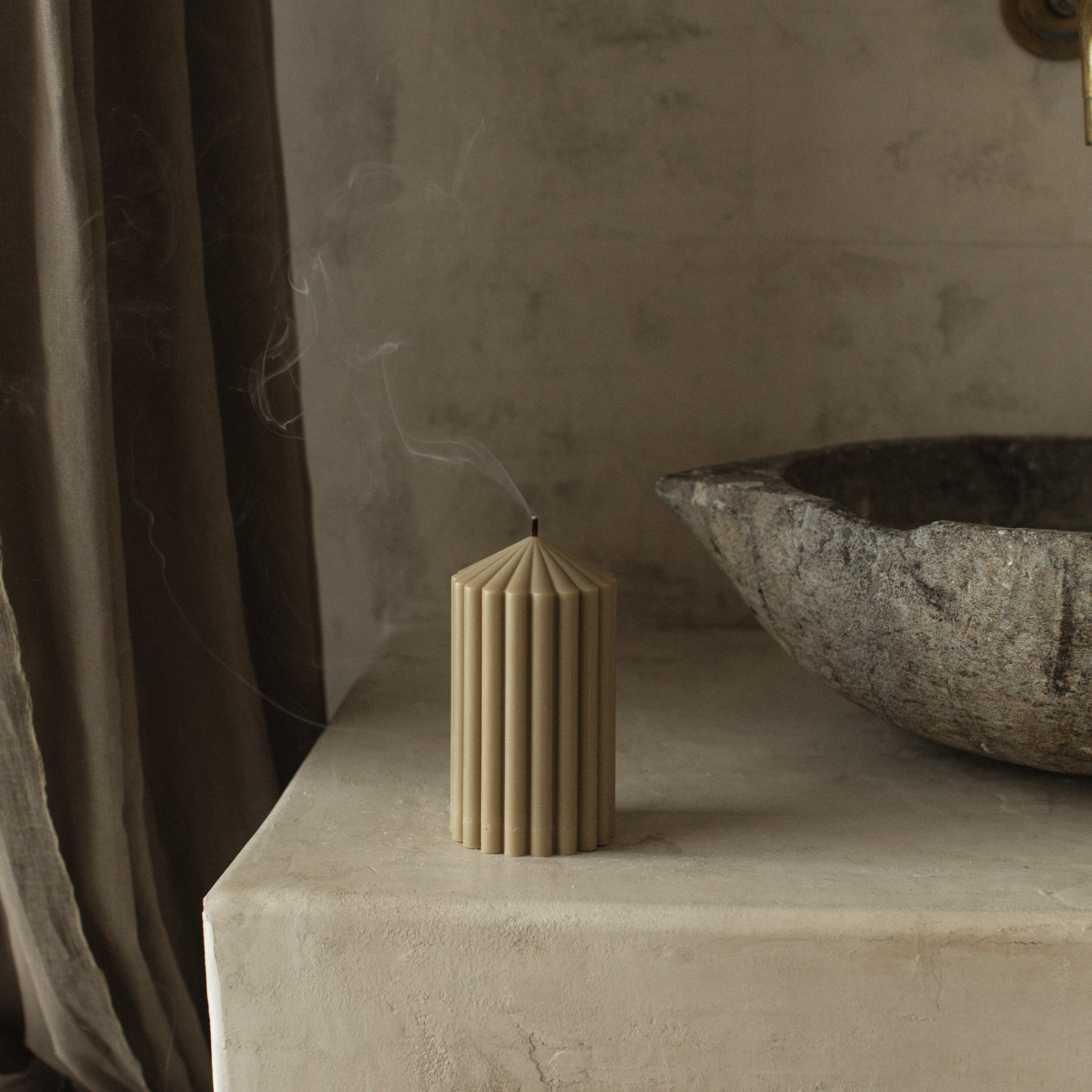 Close-up detail of handmade Peak sculptural candle showing textured soy wax surface and natural cotton wick