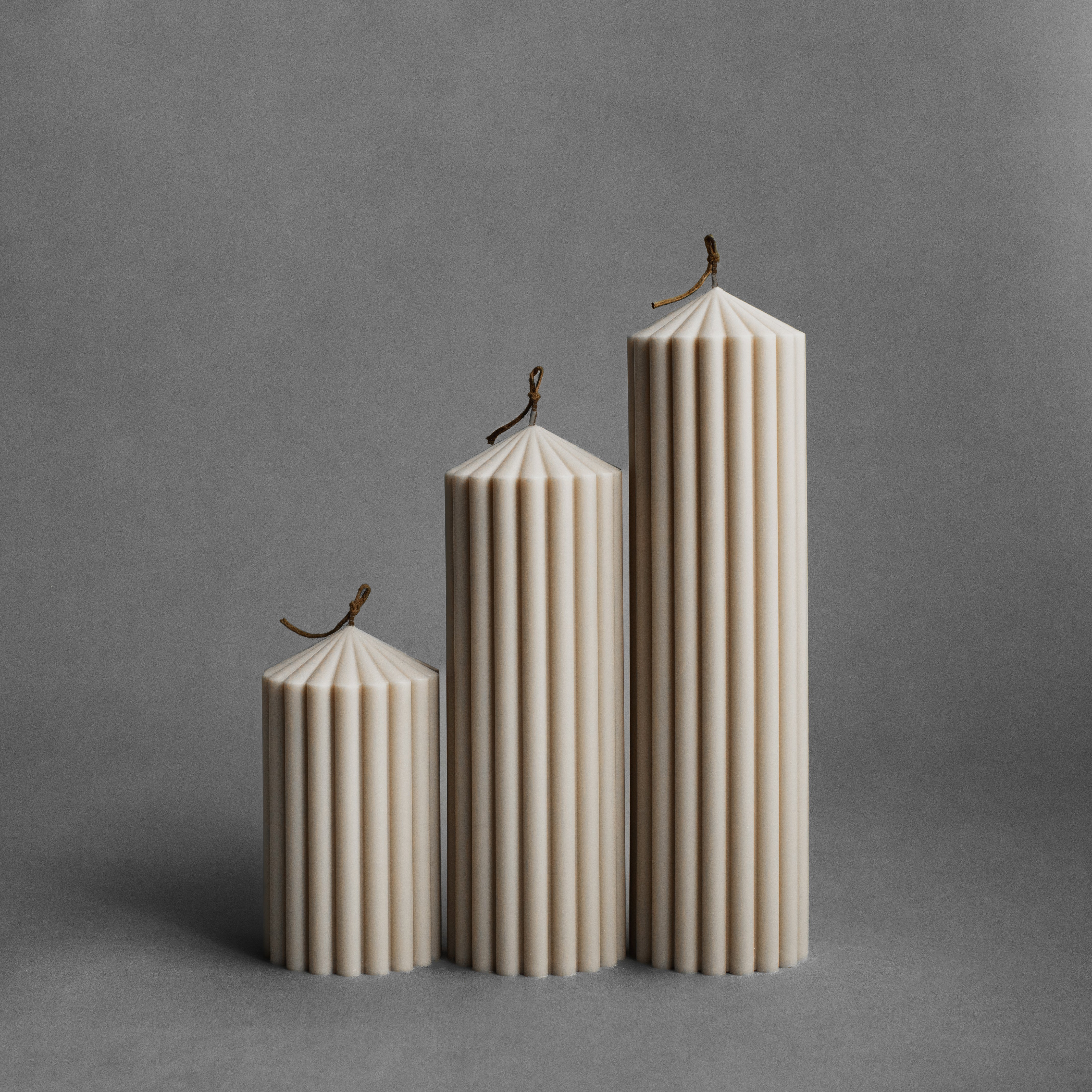 Set of three moon gray peak pillar candles by LAWA in small, medium, and large sizes
