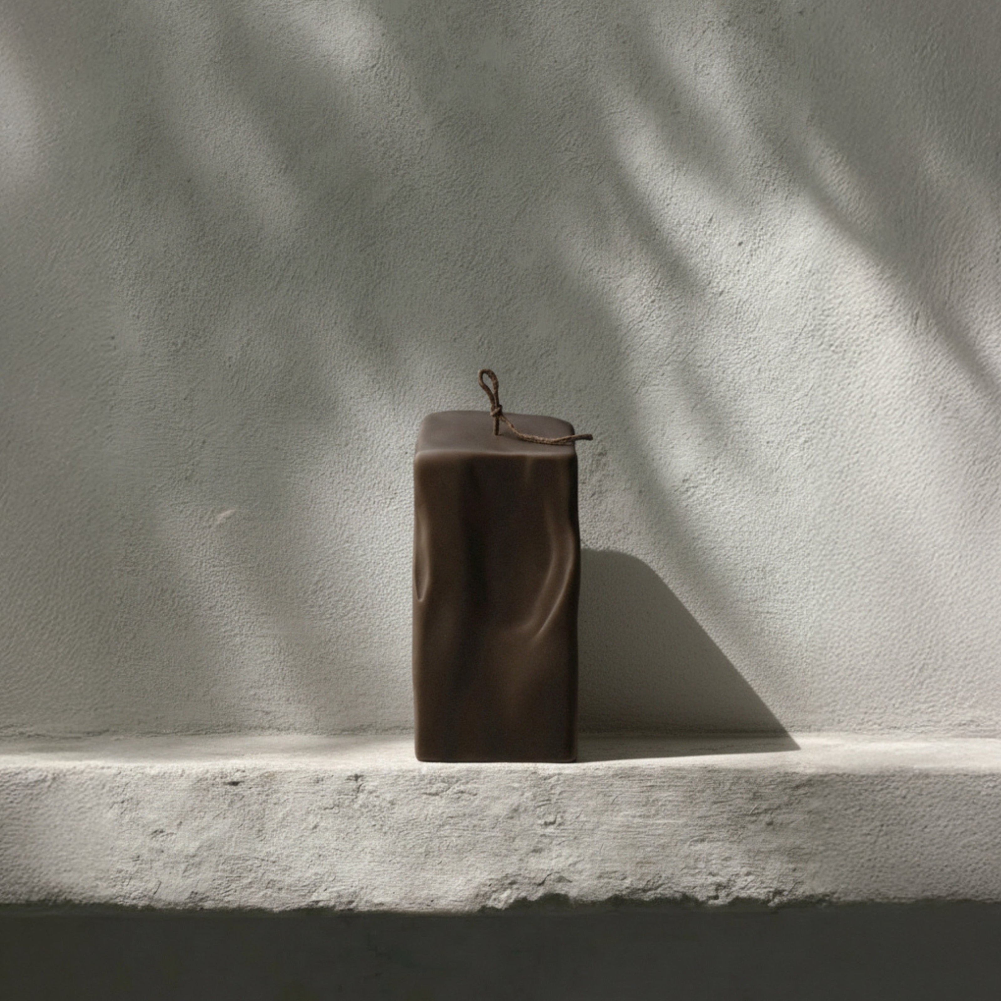 Raw Block sculptural candle handmade in Los Angeles displayed in modern minimalist home setting with natural light