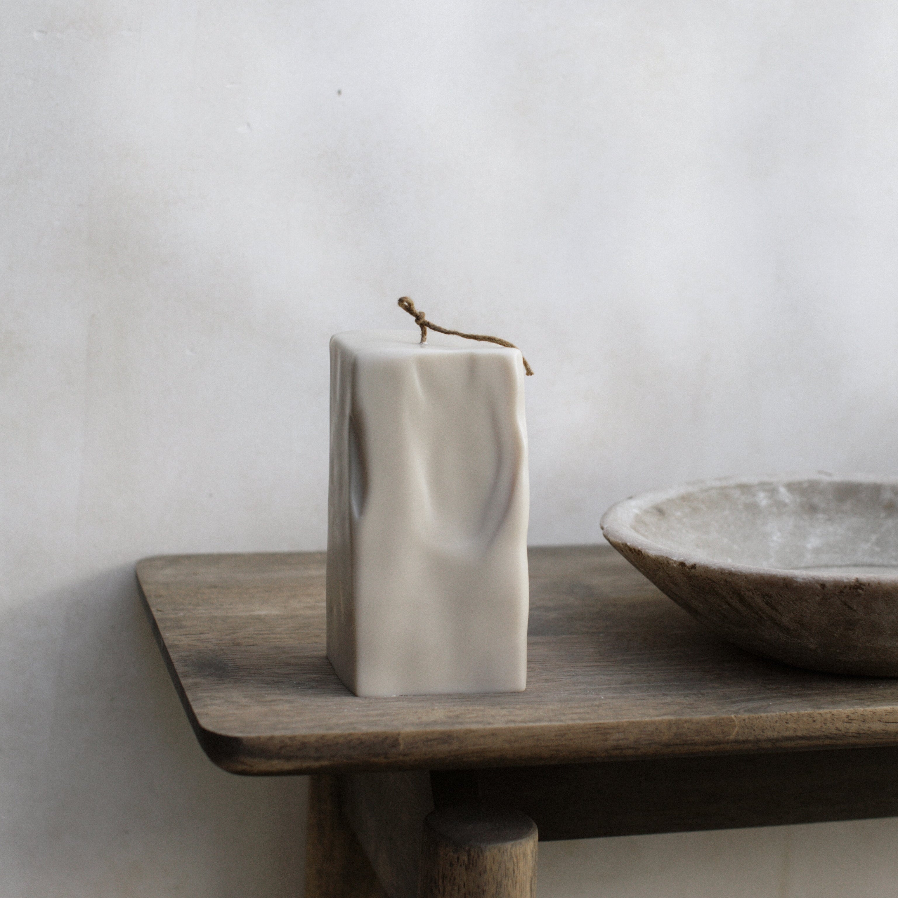Raw Block sculptural candle handmade from soy wax displayed in minimalist Los Angeles interior setting