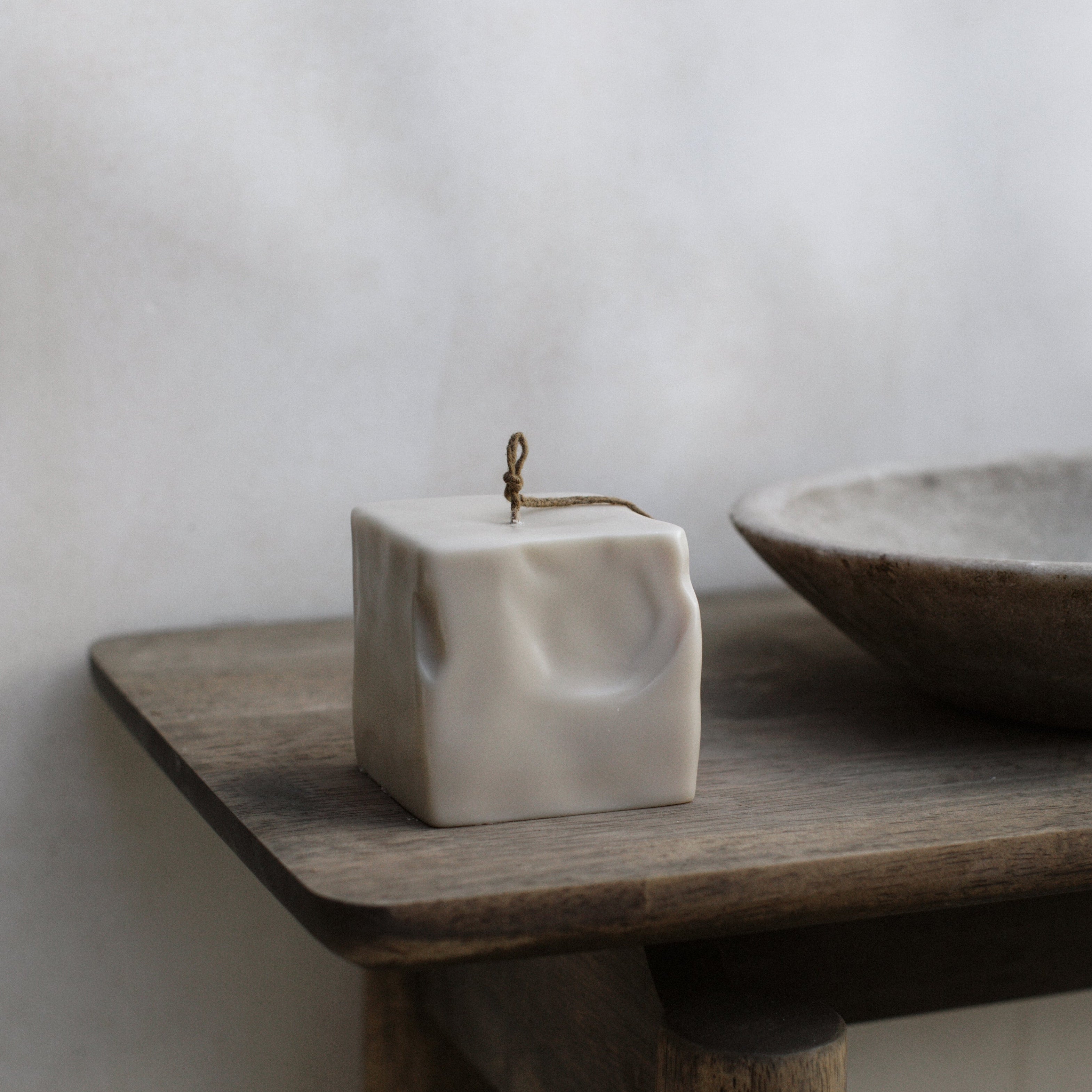 Raw Block sculptural candle detail showing handmade texture and premium soy wax finish in minimalist setting