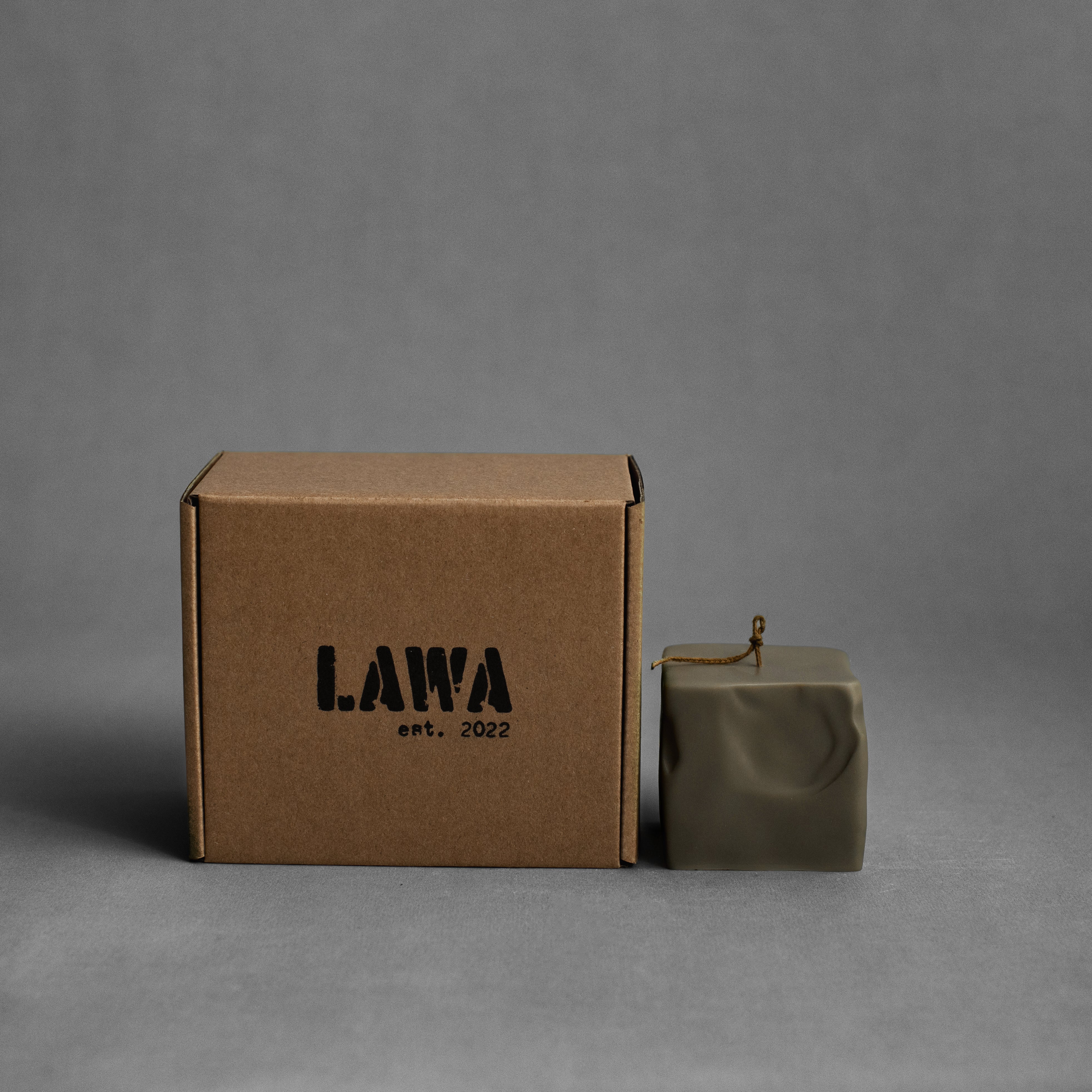 Small earthy green raw block pillar soy wax candle by LAWA with minimalist geometric shape for contemporary home styling and gifts