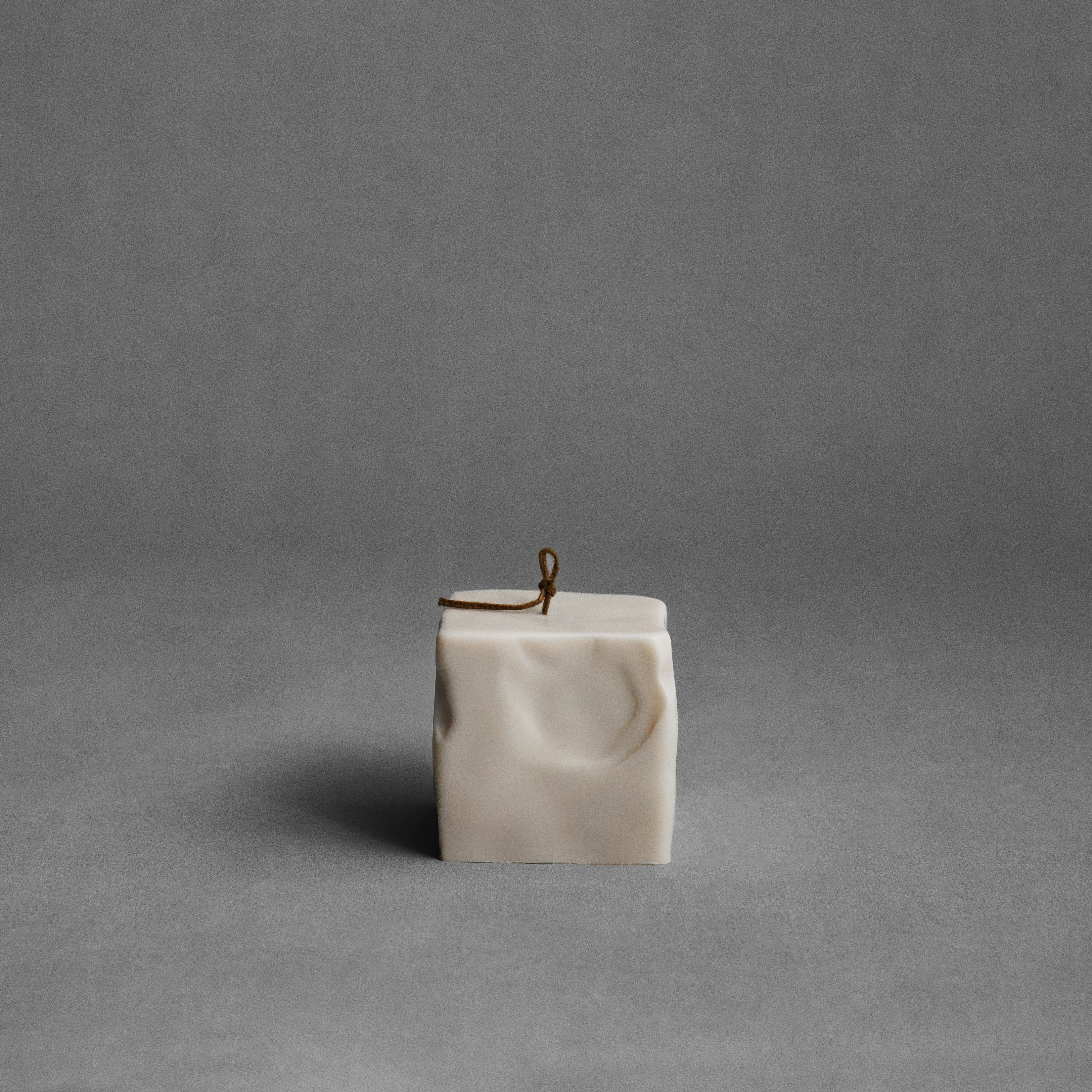 Raw Block sculptural candle detail showing handmade texture and premium soy wax finish in minimalist setting