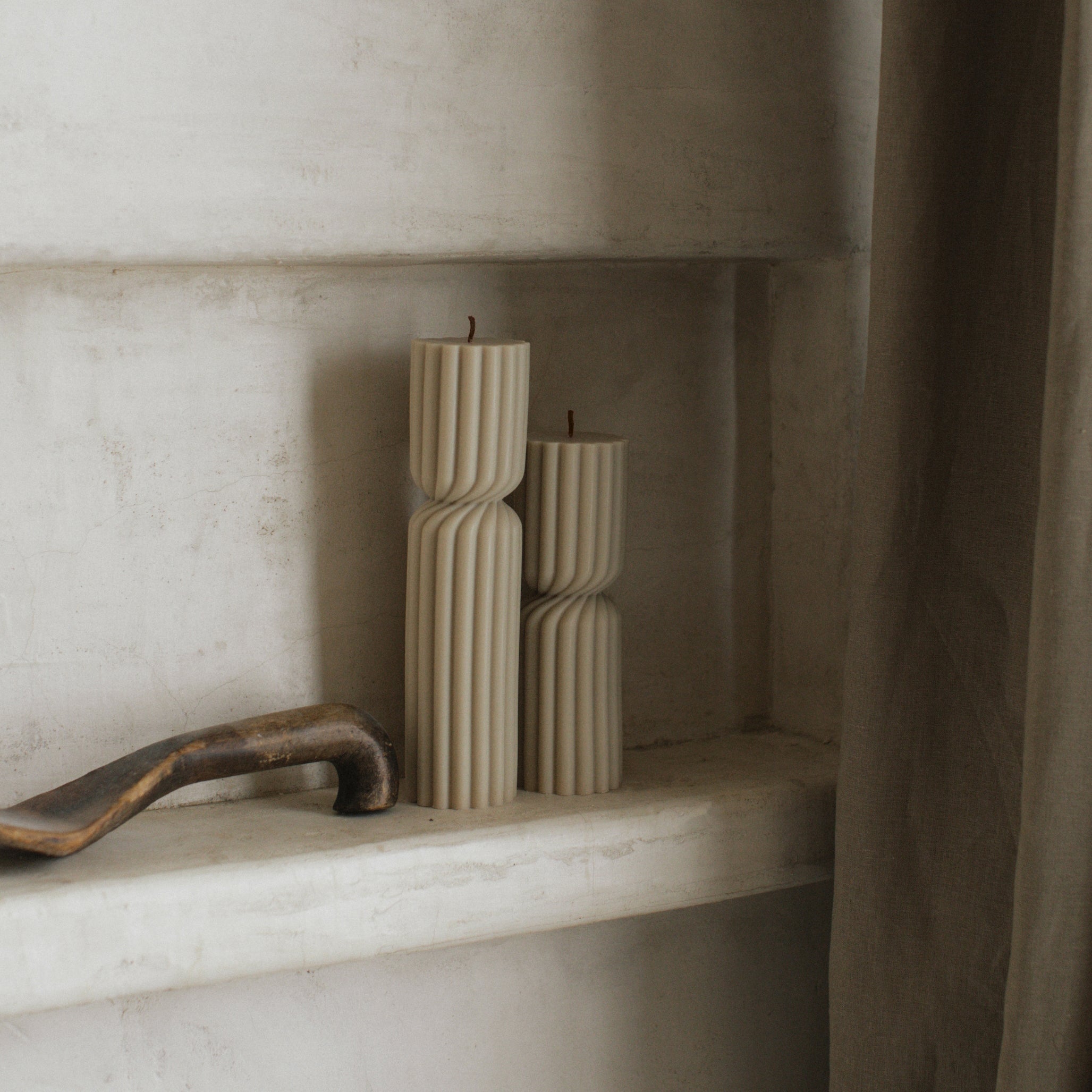 Close-up detail of handmade Spiral Spire sculptural candle showing textured soy wax surface and cotton wick