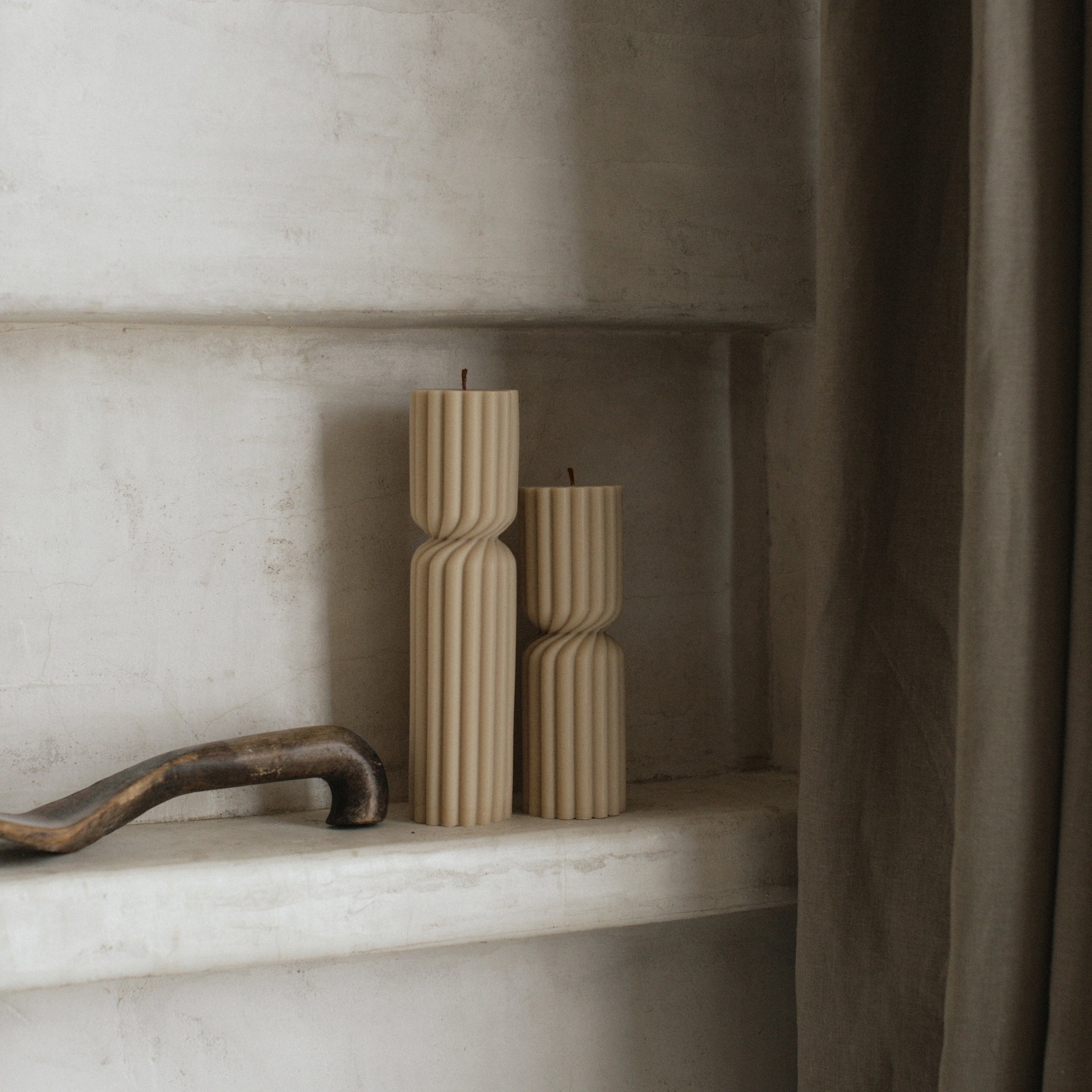 Close-up detail of handmade Spiral Spire sculptural candle showing textured soy wax surface and organic spiral form