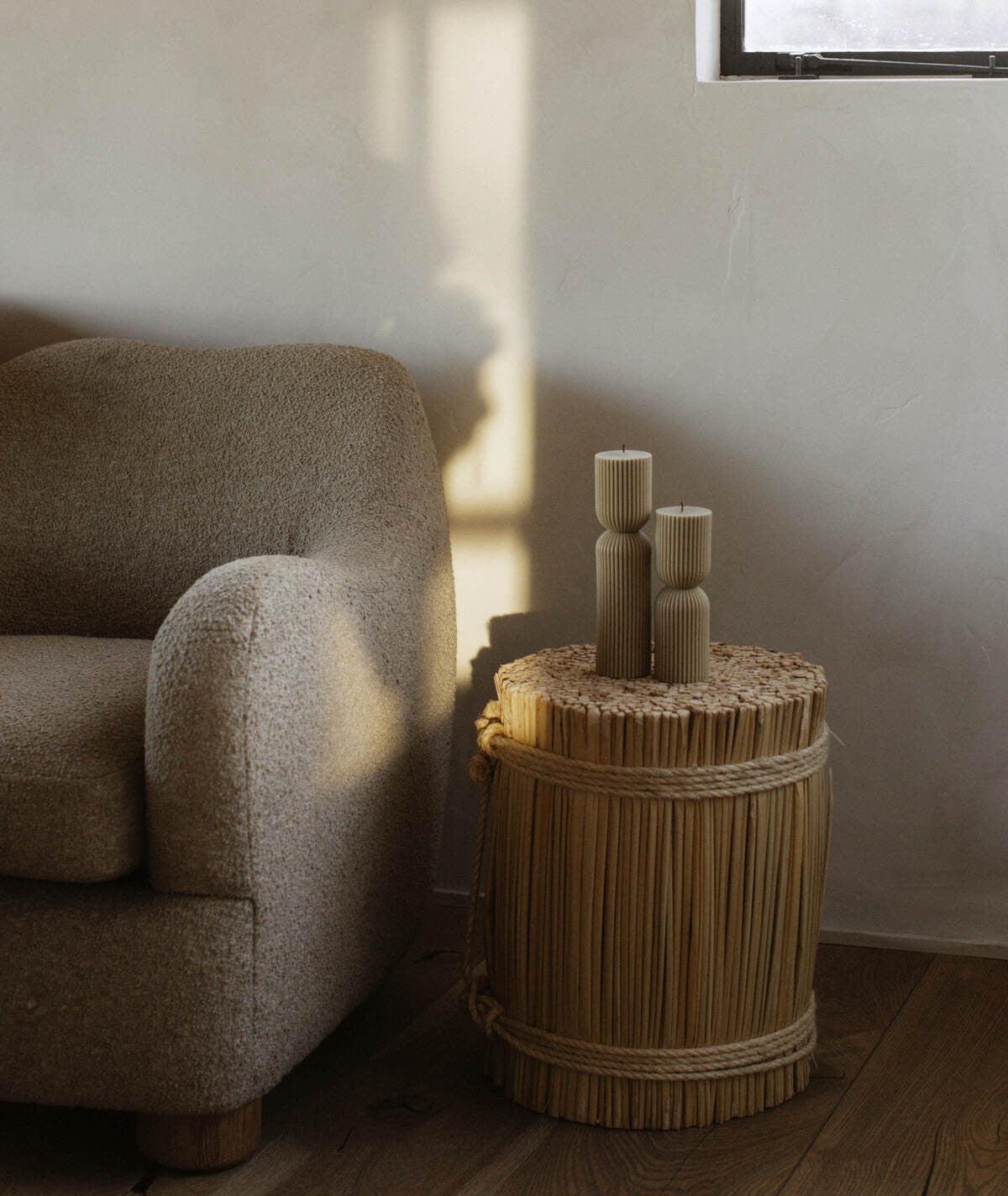  Sculptural pillar candle pair on woven side table — LAWA Candles Los Angeles