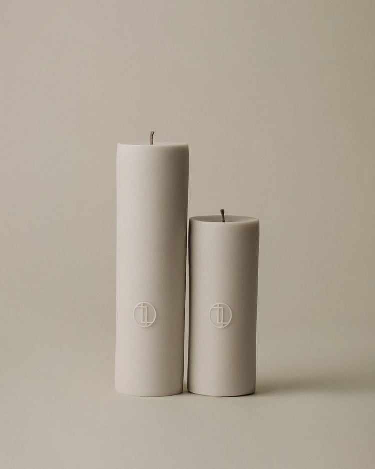 Lawa Set of 2 Pillar Beige candles on neutral background