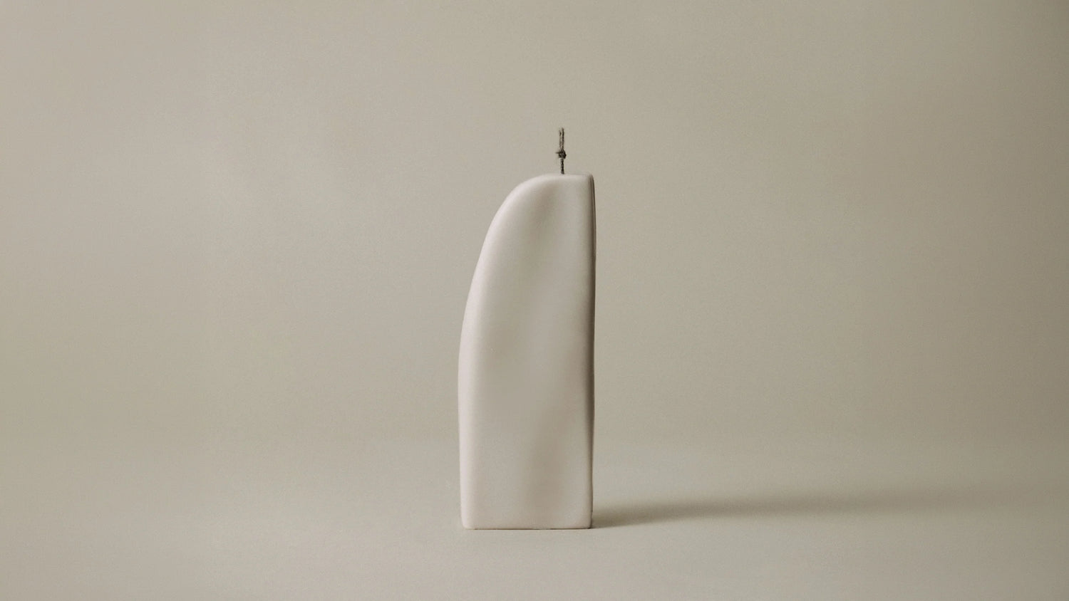 Lawa downhill dark brown candle on neutral background
