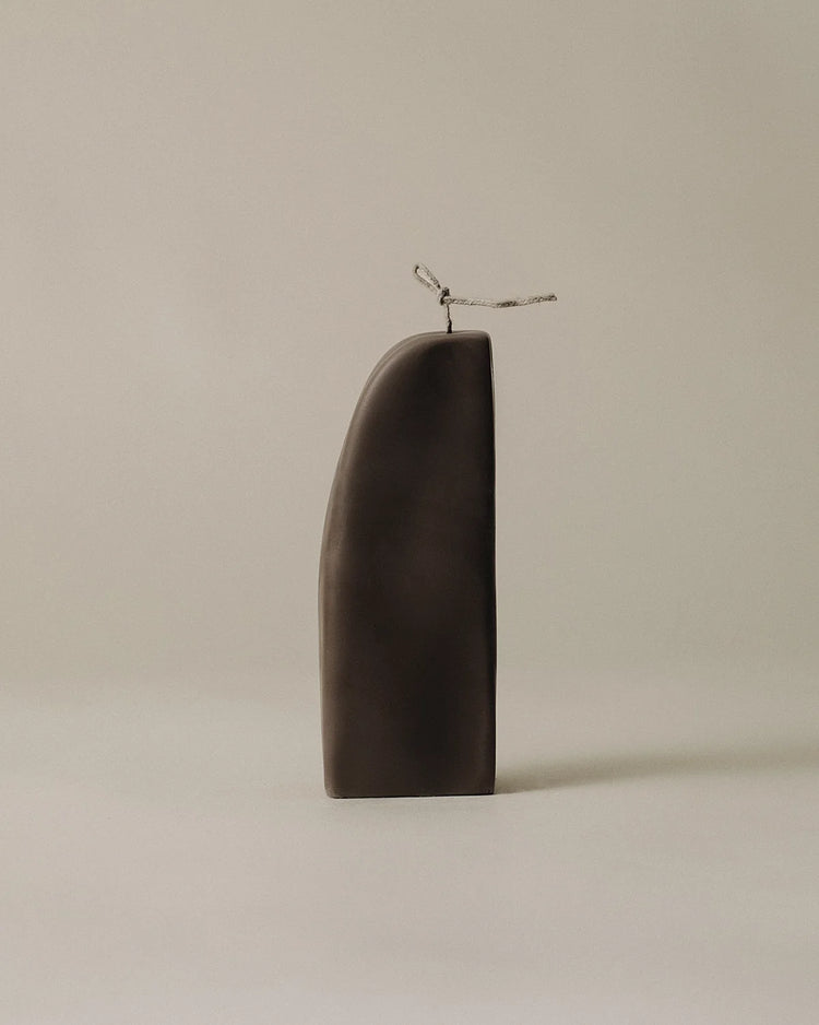 Lawa downhill dark brown candle on neutral background
