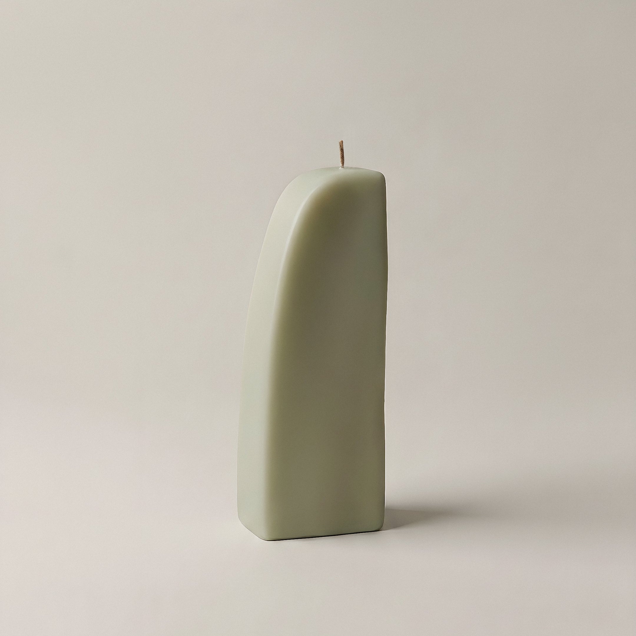 Close-up detail of handmade Downhill sculptural candle showing premium soy wax texture and natural cotton wick