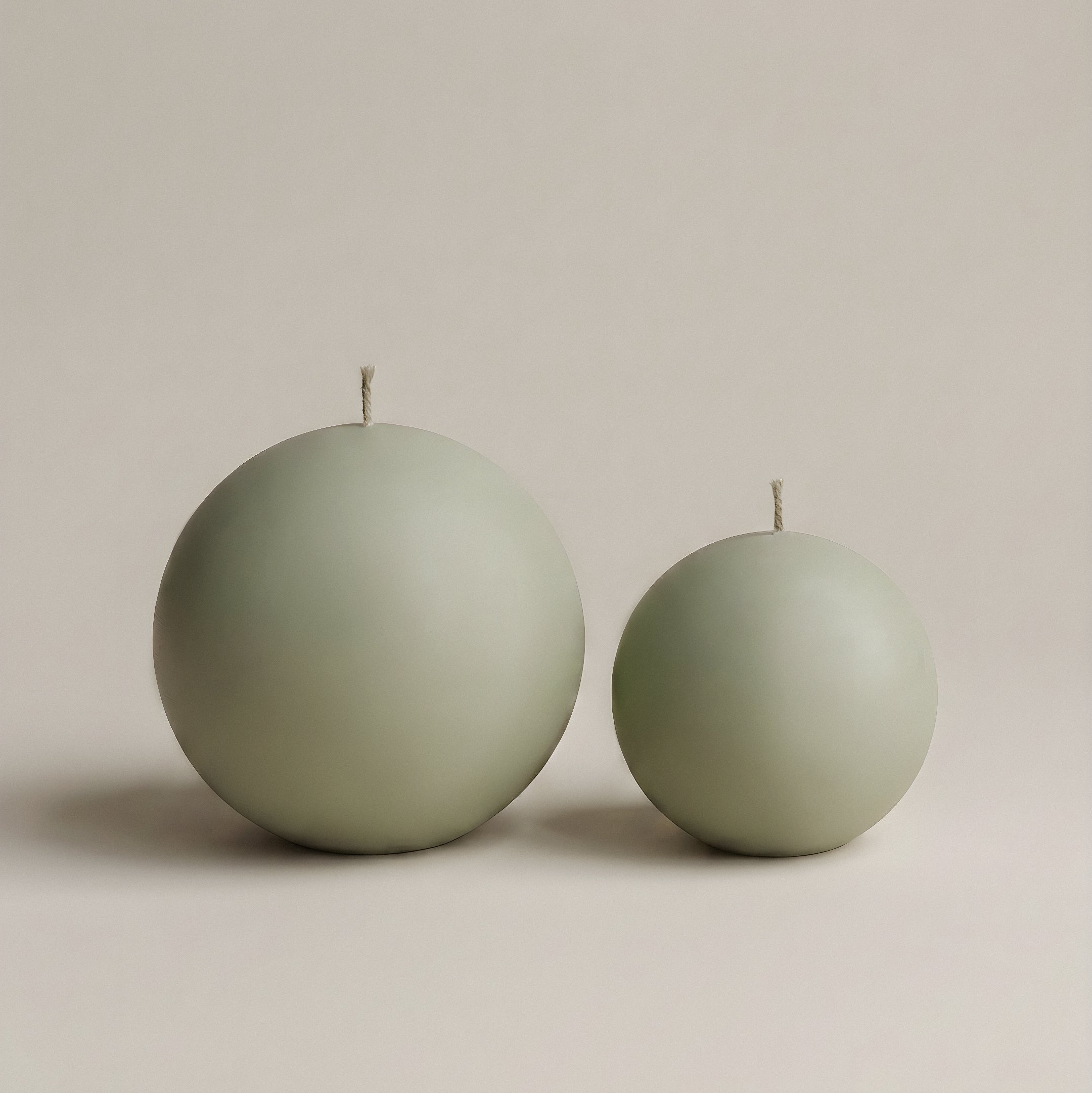 Handmade sphere sculptural candle detail showing smooth soy wax texture in Los Angeles studio setting