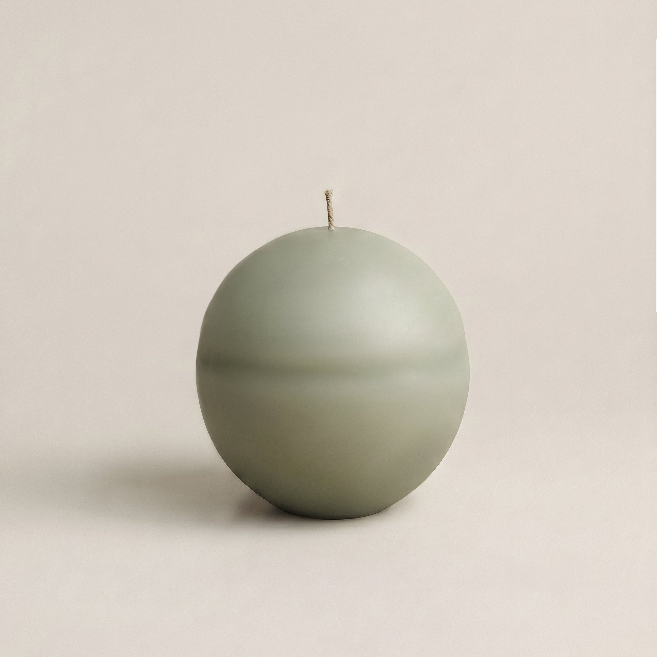 Close-up detail of handmade soy wax texture on unscented Imperfect Sphere sculptural candle from Los Angeles