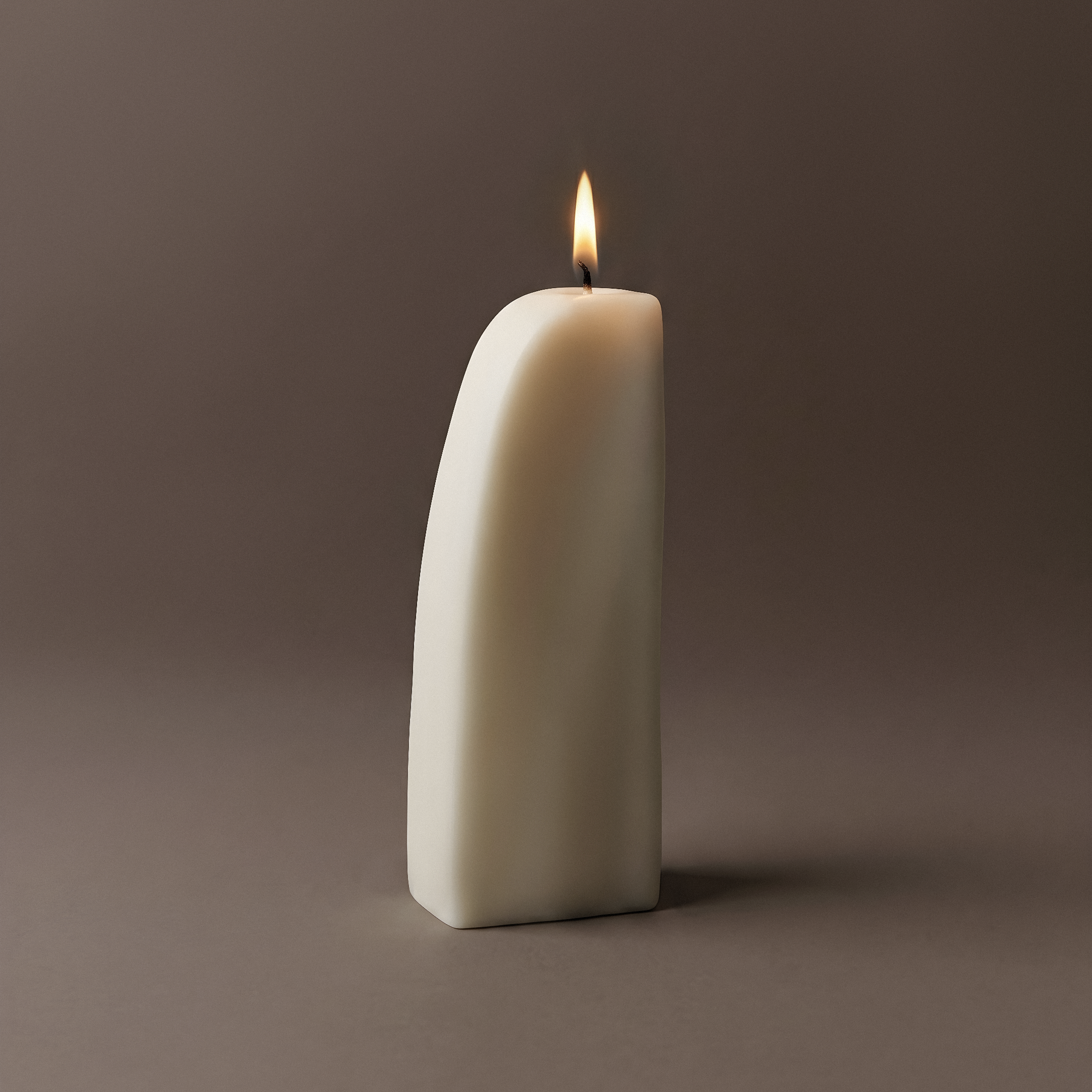 Close-up detail of handmade Downhill sculptural candle showing premium soy wax texture and cotton wick