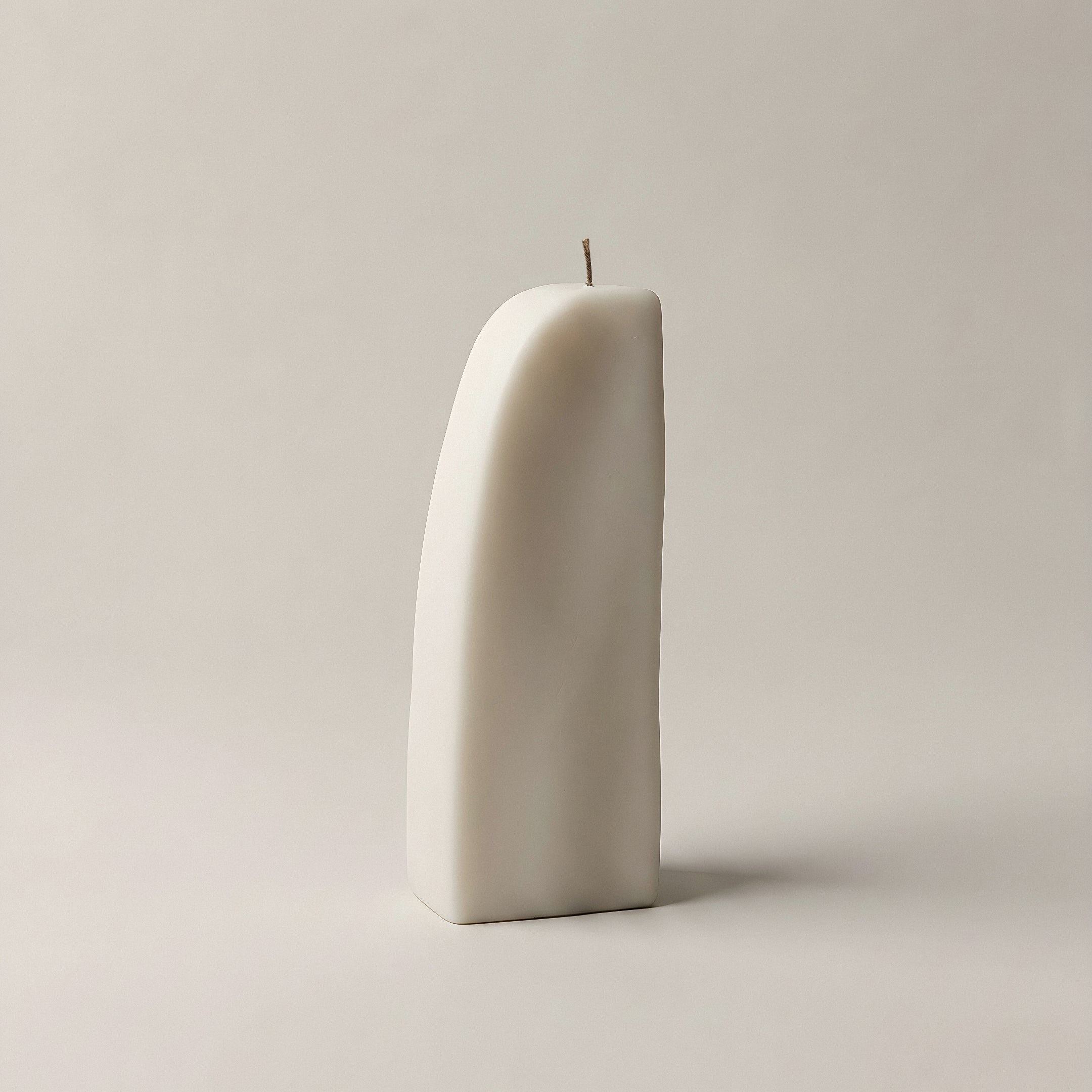 Close-up detail of handmade Downhill sculptural candle showing premium soy wax texture and cotton wick