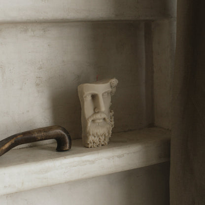Greek face sculptural candle handmade from soy wax showing side profile detail against white background
