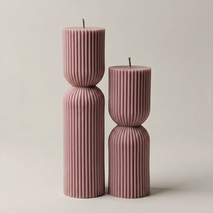 Close-up detail of handmade hourglass sculptural candle showing smooth soy wax texture and elegant curves