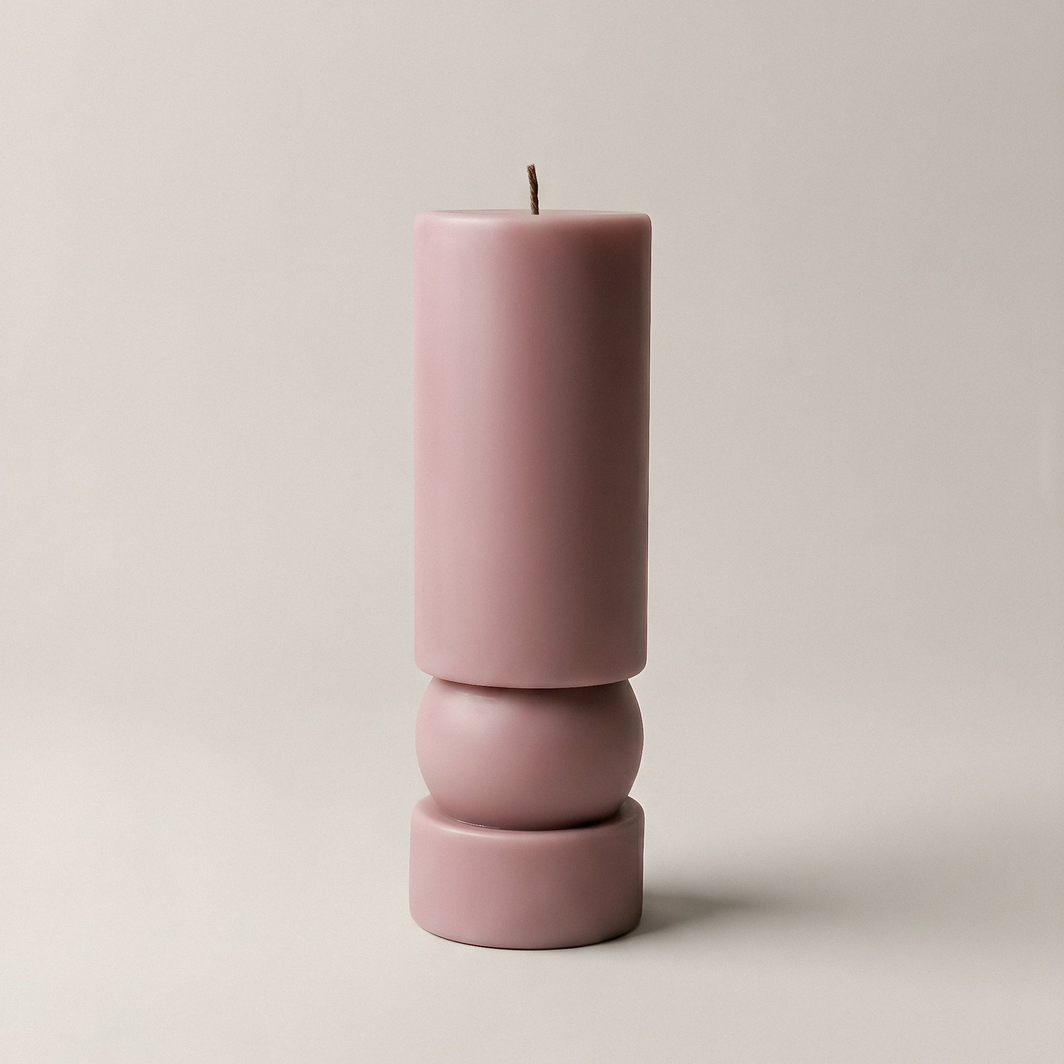 Close-up detail of handmade Zen sculptural candle showing smooth soy wax texture and natural cotton wick