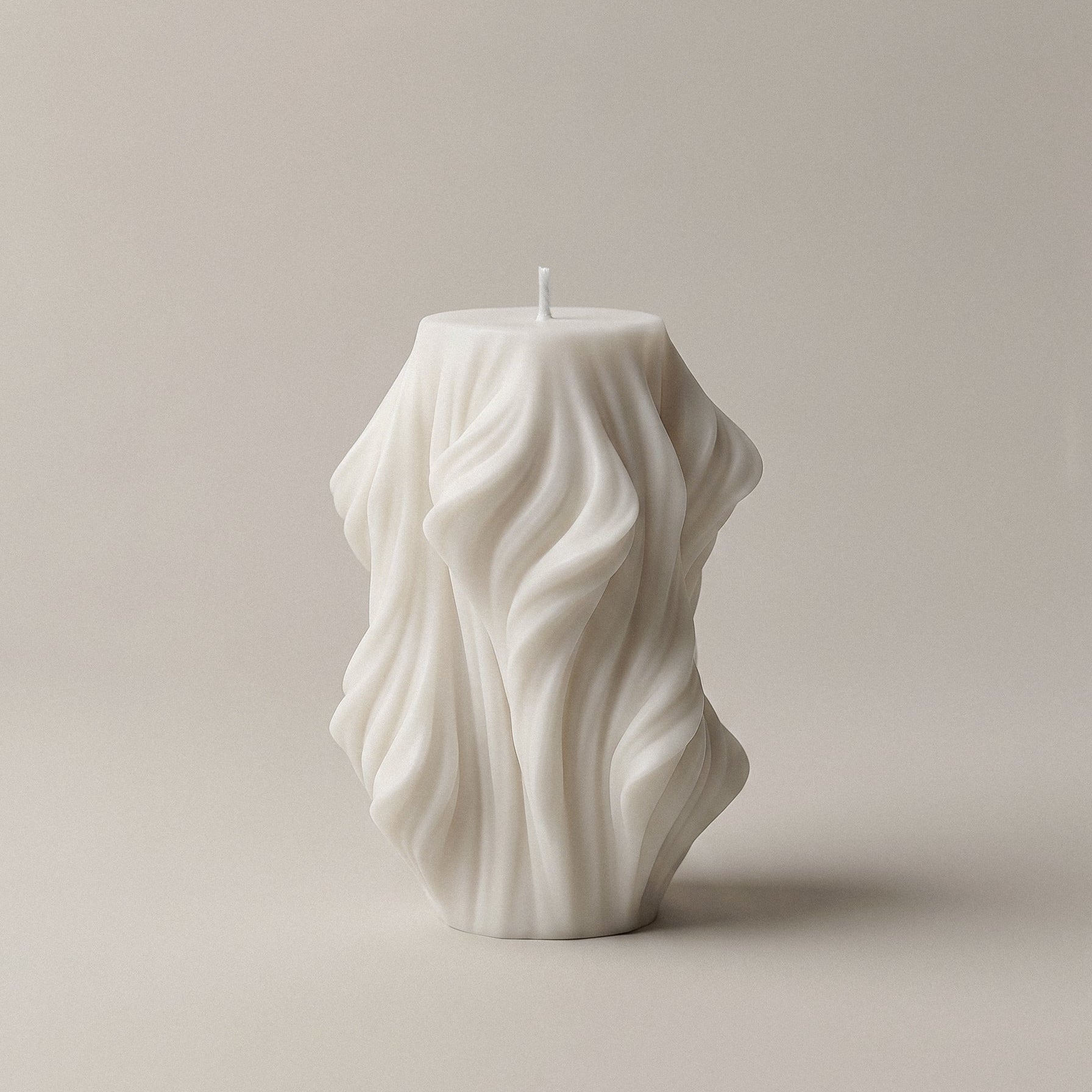 Close-up detail of handmade sculptural candle showing cascading wave texture in premium soy wax made in Los Angeles