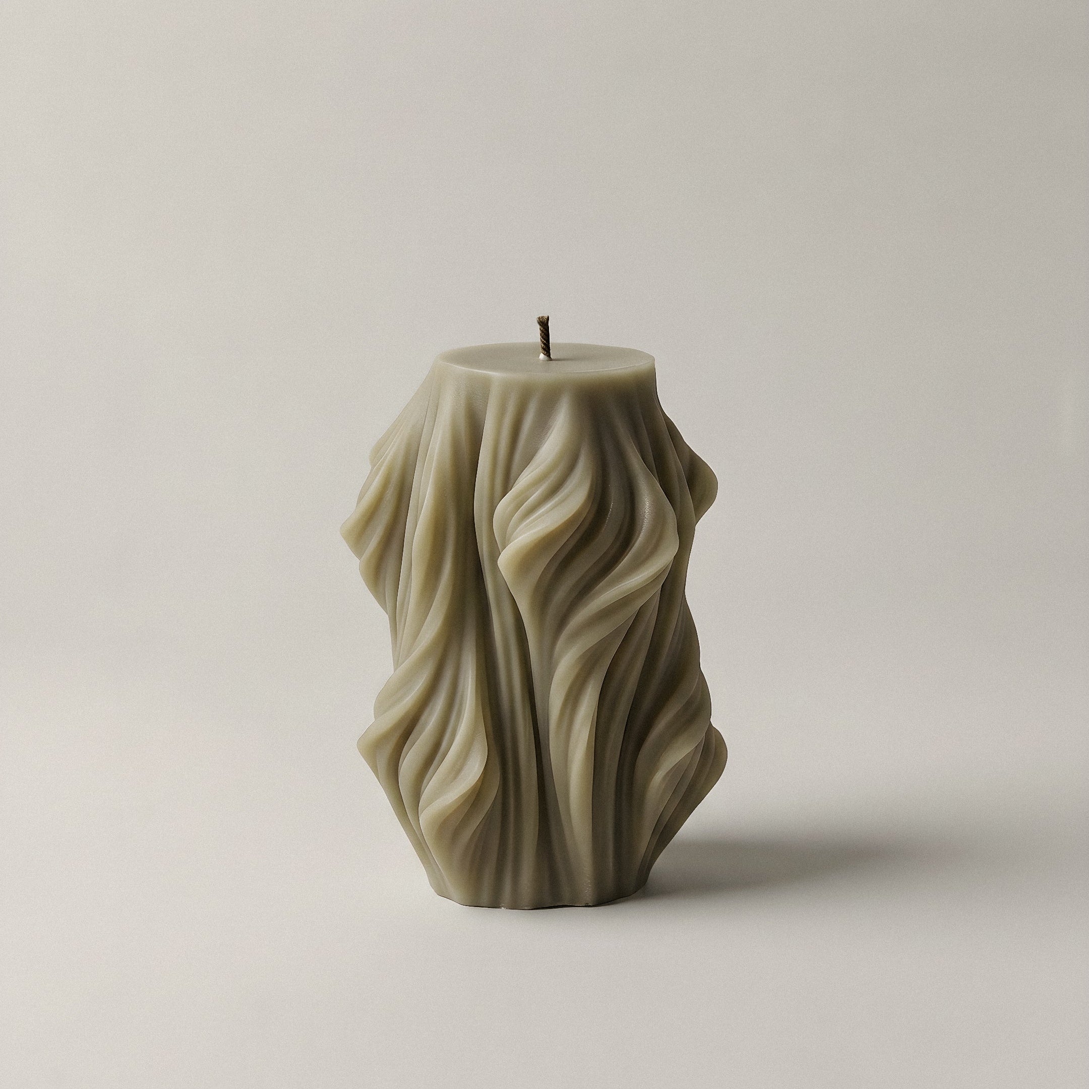 Close-up detail of handmade sculptural candle showing cascading wave texture in premium soy wax made in Los Angeles