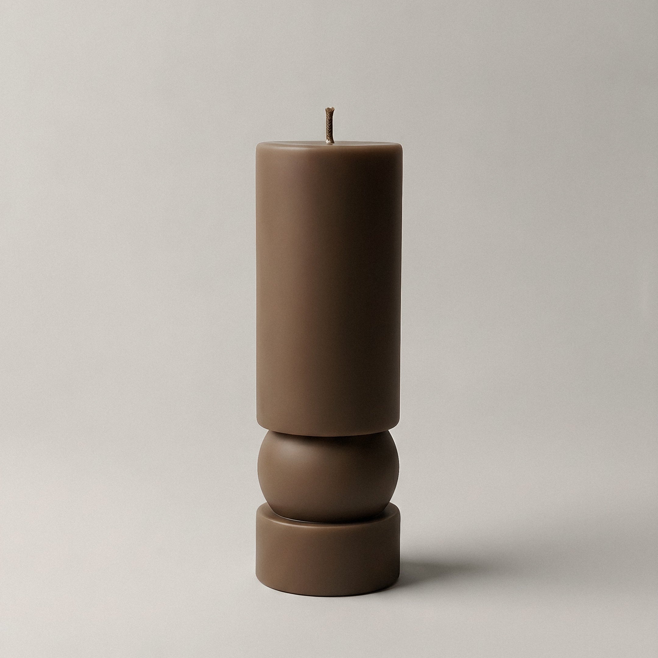 Zen sculptural candle handmade from soy wax displayed in minimalist home setting with natural light