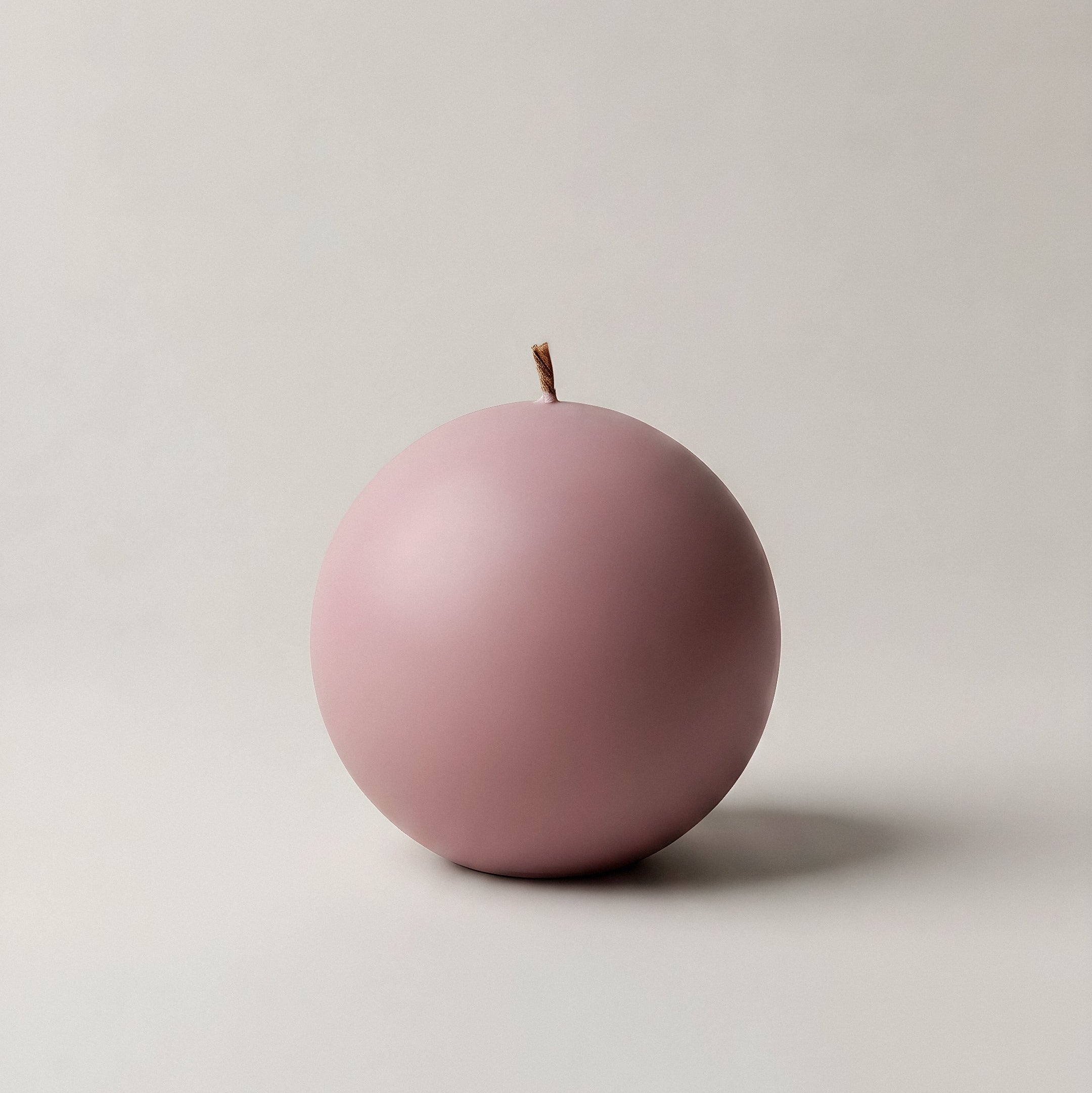 Handmade unscented sphere candle in premium soy wax displayed in modern Los Angeles home interior setting