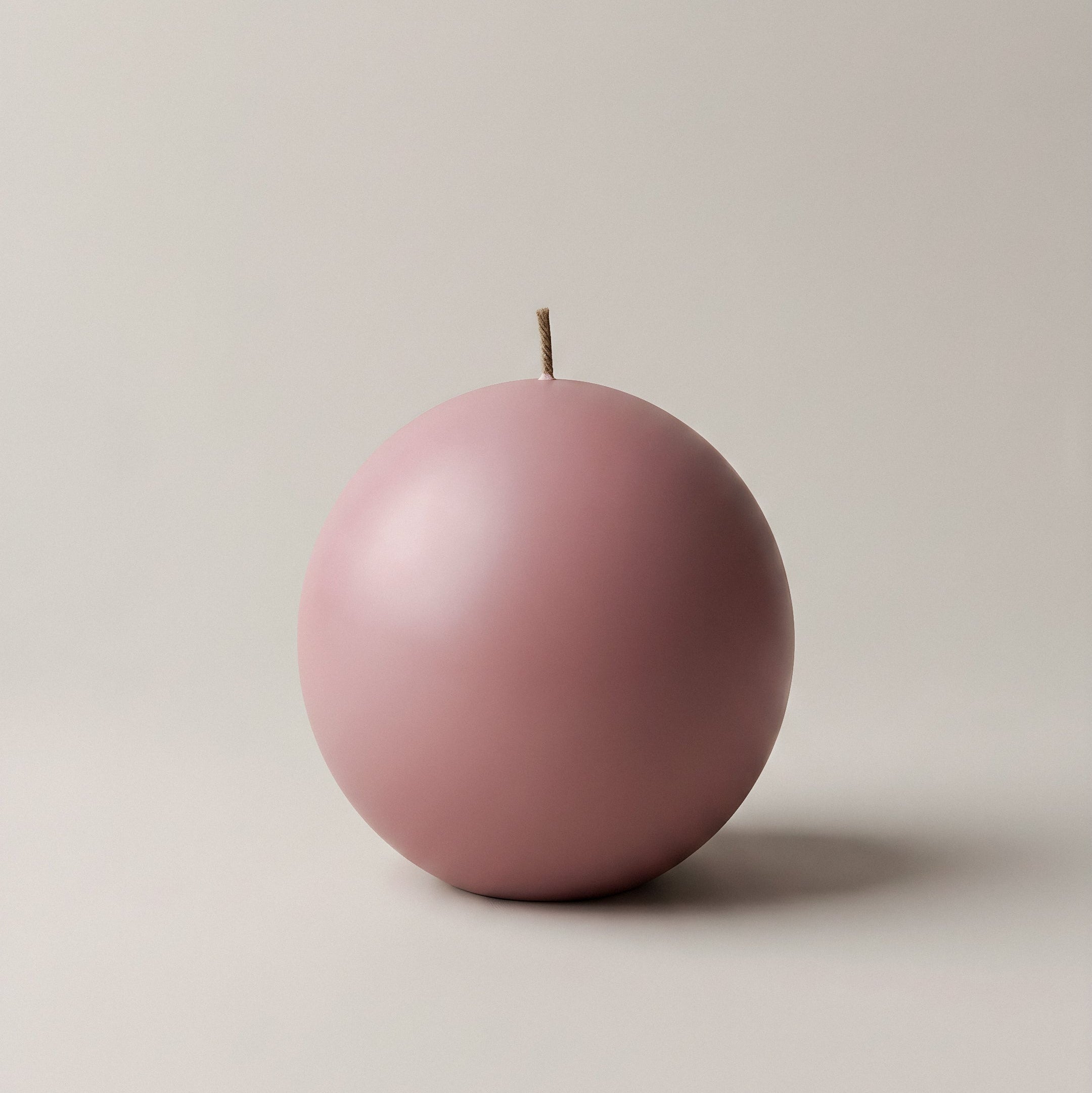 Handmade sphere sculptural candle made from premium soy wax displayed in modern Los Angeles home setting