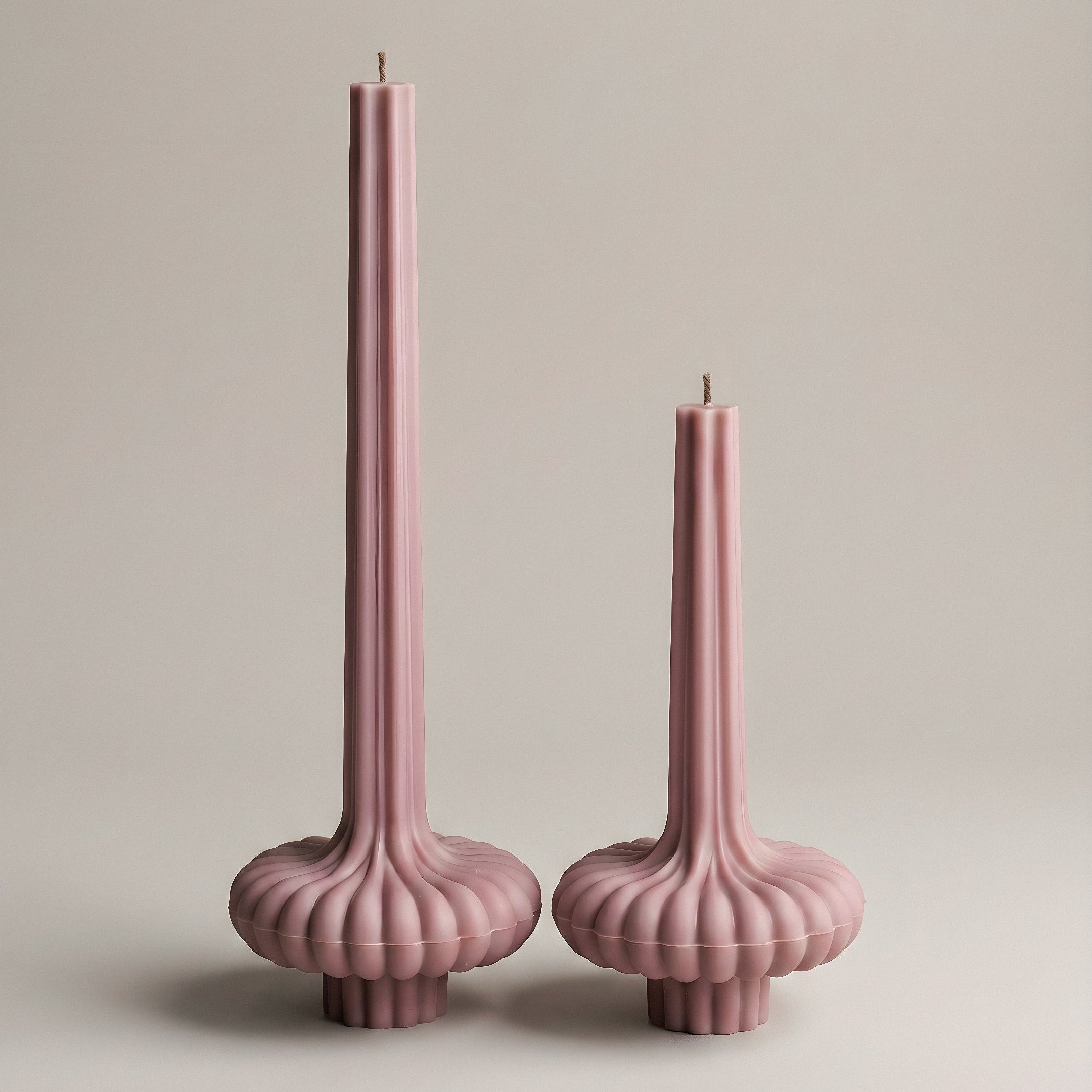 Close-up detail of handmade pumpkin sculptural candle showing textured soy wax surface and natural ridges