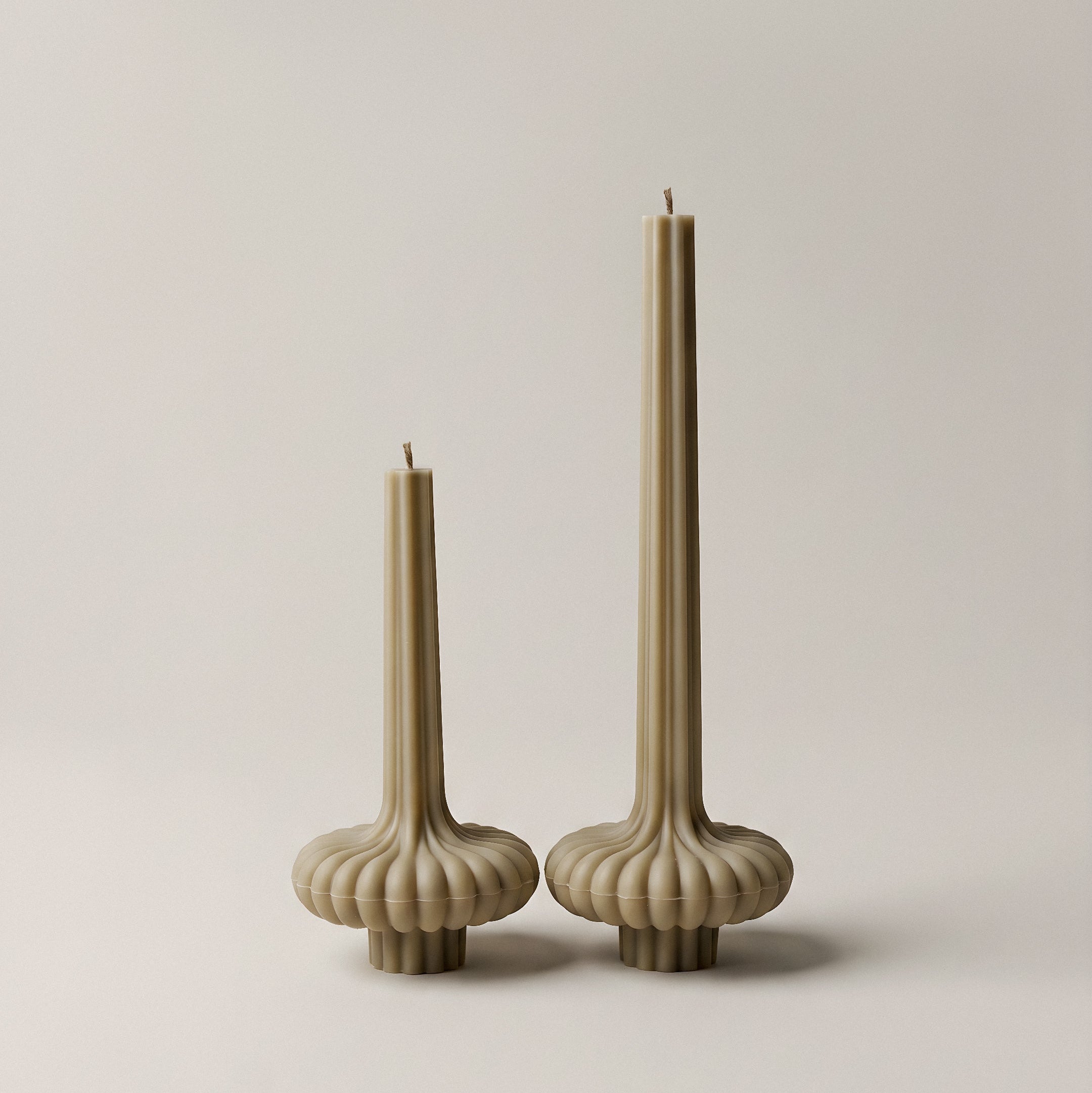 Close-up detail of handmade pumpkin sculptural candle showing premium soy wax texture and organic curves