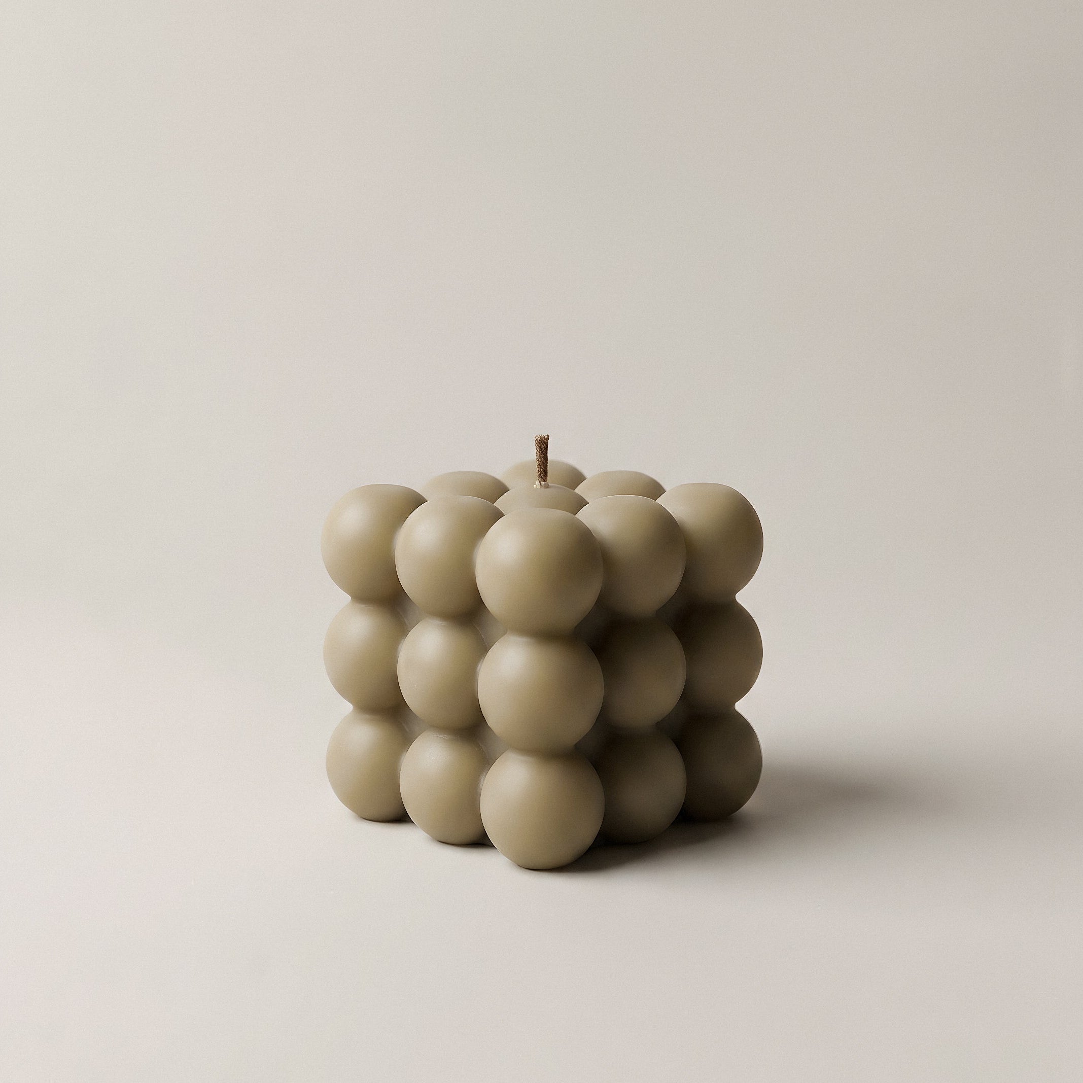 Close-up detail of handmade bubble sculptural candle texture showing premium soy wax surface in Los Angeles studio