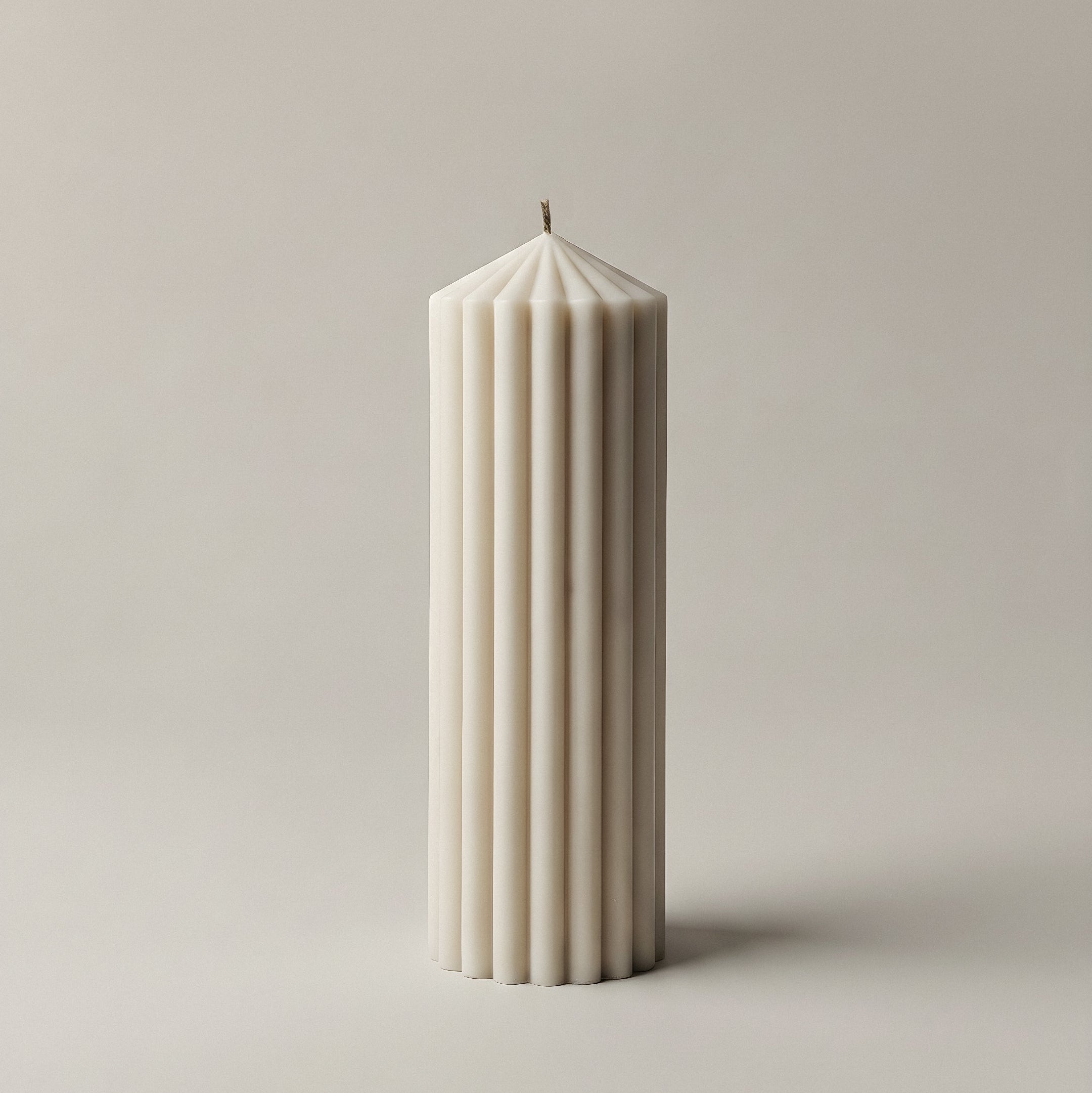 Close-up detail of handmade Peak sculptural candle showing premium soy wax texture and cotton wick
